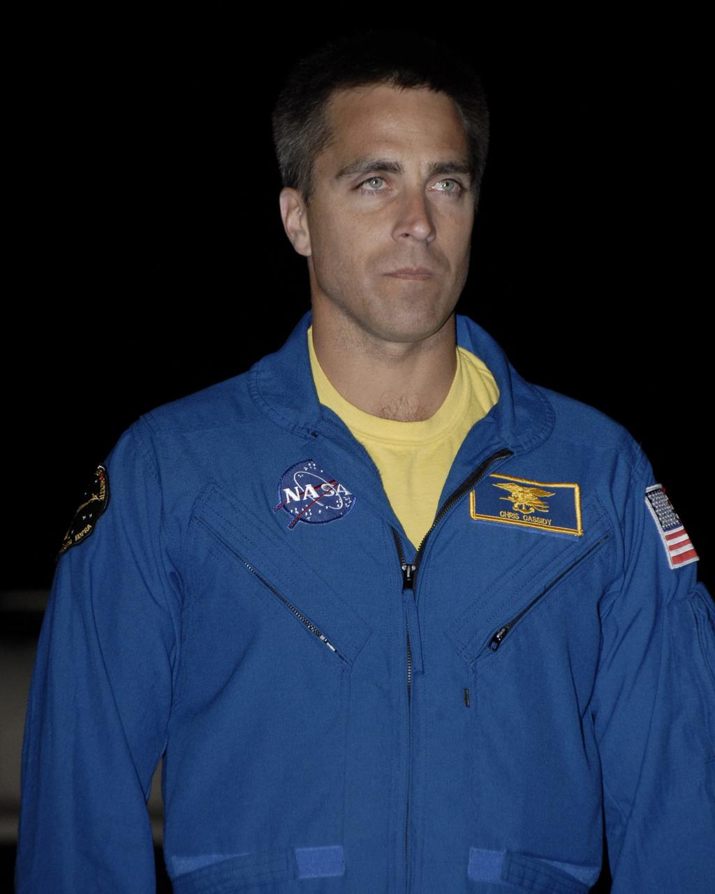 CAPE CANAVERAL, Fla. – At the Shuttle Landing Facility, STS-127 Mission Specialist Christopher Cassidy is greeted by the media and others on hand to welcome the STS-127 crew to NASA's Kennedy Space Center in Florida. Cassidy and the other members of the crew arrived from Houston aboard a Shuttle Training Aircraft to get ready for launch on space shuttle Endeavour on June 13.  Cassidy, a commander in the U.S. Navy, is a former Navy SEAL and is making his first shuttle flight.  The STS-127 mission is the final of three flights dedicated to the assembly of the Japan Aerospace Exploration Agency's Kibo laboratory complex on the International Space Station.  Endeavour will deliver the Japanese Experiment Module's Exposed Facility, or JEM-EF, and the Experiment Logistics Module-Exposed Section, or ELM-ES, to the space station on STS-127.  Photo credit: NASA/Kim Shiflett