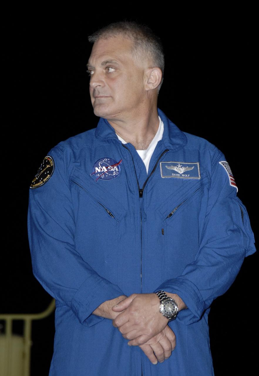 CAPE CANAVERAL, Fla. – At the Shuttle Landing Facility, STS-127 Mission Specialist Dave Wolf is greeted by the media and others on hand to welcome the STS-127 crew to NASA's Kennedy Space Center in Florida. Wolf and the other members of the crew arrived from Houston aboard a Shuttle Training Aircraft to get ready for launch on space shuttle Endeavour on June 13.  Wolf, a medical doctor, spent 128 days on the Russian space station Mir and is making his fourth shuttle flight.  The STS-127 mission is the final of three flights dedicated to the assembly of the Japan Aerospace Exploration Agency's Kibo laboratory complex on the International Space Station.  Endeavour will deliver the Japanese Experiment Module's Exposed Facility, or JEM-EF, and the Experiment Logistics Module-Exposed Section, or ELM-ES, to the space station on STS-127.  Photo credit: NASA/Kim Shiflett