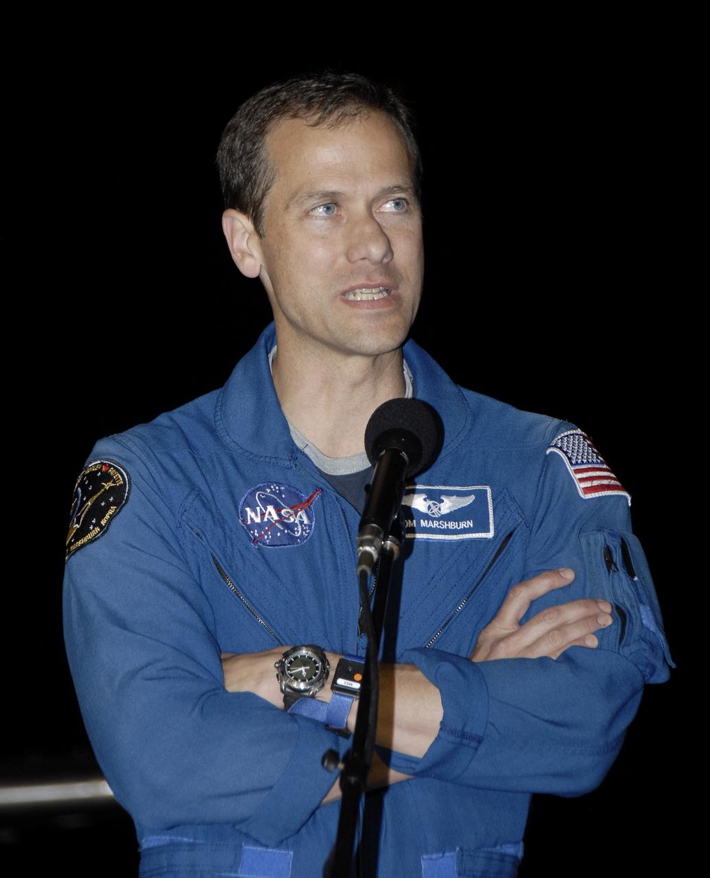 CAPE CANAVERAL, Fla. – At the Shuttle Landing Facility, STS-127 Mission Specialist Tom Marshburn addresses the media and those on hand to welcome the STS-127 crew to NASA's Kennedy Space Center in Florida.  Marshburn and the other members of the crew arrived from Houston aboard a Shuttle Training Aircraft to get ready for launch on space shuttle Endeavour on June 13.  Marshburn, a former NASA flight surgeon, is making his first shuttle flight.  The STS-127 mission is the final of three flights dedicated to the assembly of the Japan Aerospace Exploration Agency's Kibo laboratory complex on the International Space Station.  Endeavour will deliver the Japanese Experiment Module's Exposed Facility, or JEM-EF, and the Experiment Logistics Module-Exposed Section, or ELM-ES, to the space station on STS-127.  Photo credit: NASA/Kim Shiflett