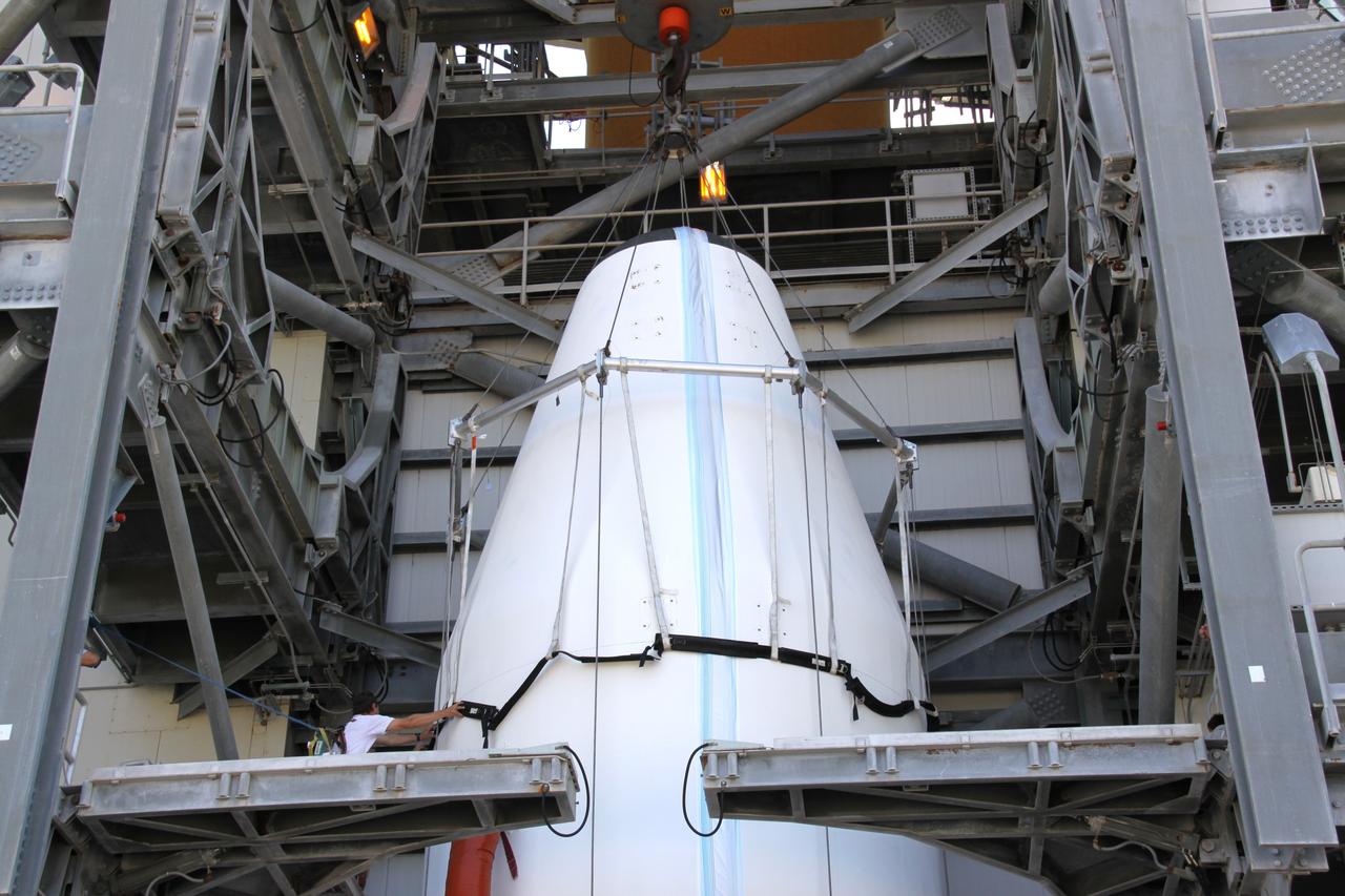 CAPE CANAVERAL, Fla. – On Launch Complex 37 at Cape Canaveral Air Force Station in Florida, workers finish attaching the sling on the GOES-O satellite that will to lift it into the mobile service tower where it will be mated with the United Launch Alliance Delta IV expendable launch vehicle. The GOES-O satellite is targeted to launch no earlier than June 26. The latest Geostationary Operational Environmental Satellite, GOES-O was developed by NASA for the National Oceanic and Atmospheric Administration, or NOAA. The GOES satellites continuously provide observations of 60 percent of the Earth including the continental United States, providing weather monitoring and forecast operations as well as a continuous and reliable stream of environmental information and severe weather warnings. Once in orbit, GOES-O will be designated GOES-14, and NASA will provide on-orbit checkout and then transfer operational responsibility to NOAA.   Photo credit: NASA/Jack Pfaller