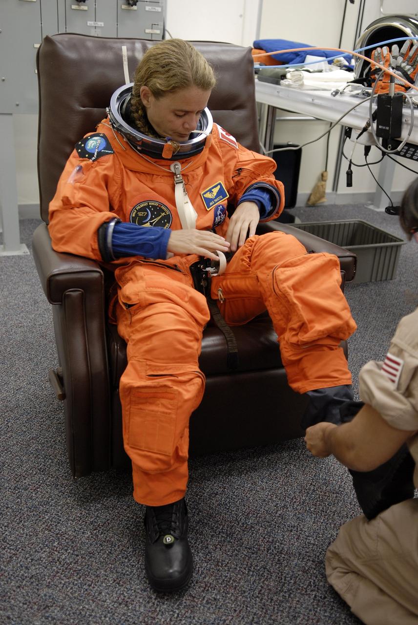 CAPE CANAVERAL, Fla. –  At NASA's Kennedy Space Center in Florida, STS-127 Mission Specialist Julie Payette checks the fit of her launch-and-entry suit in preparation for space shuttle Endeavour's launch on June 13 to the International Space Station.  Payette, who is with the Canadian Space Agency, will be making her second shuttle flight.  Endeavour will deliver the Japanese Experiment Module's Exposed Facility, or JEM-EF, and the Experiment Logistics Module-Exposed Section, or ELM-ES, on STS-127. The mission is the final of three flights dedicated to the assembly of the Japan Aerospace Exploration Agency's Kibo laboratory complex on the space station.   Photo credit: NASA/Kim Shiflett