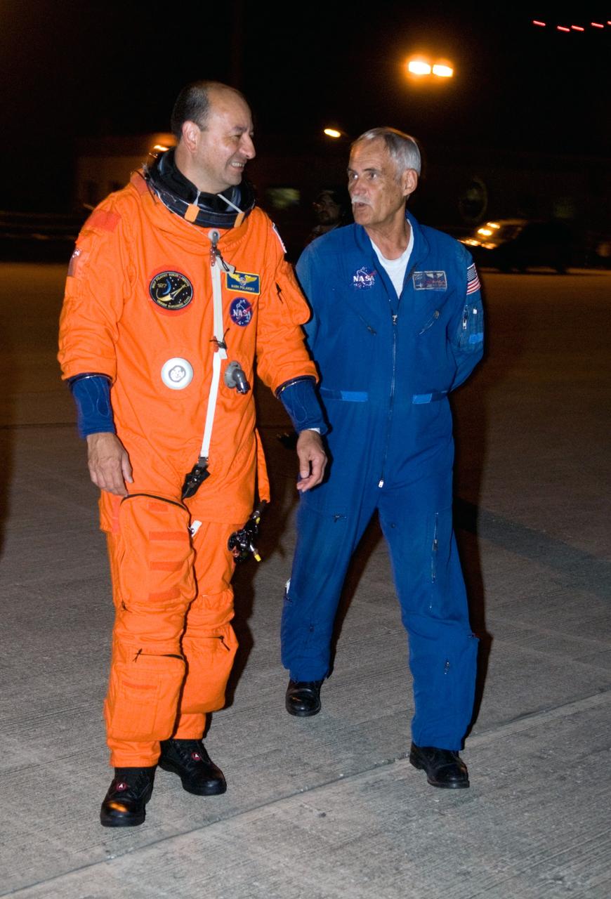 CAPE CANAVERAL, Fla. –  At the Shuttle Landing Facility at NASA's Kennedy Space Center in Florida, STS-127 Commander Mark Polansky makes his way to the Shuttle Training Aircraft to practice landings in preparation for launch of space shuttle Endeavour on the STS-127 mission on June 13 to the International Space Station. The STA is a Grumman American Aviation-built Gulfstream II jet that was modified to simulate a shuttle’s cockpit, motion and visual cues, and handling qualities. Endeavour will deliver the Japanese Experiment Module's Exposed Facility, or JEM-EF, and the Experiment Logistics Module-Exposed Section, or ELM-ES. on STS-127. The mission is the final of three flights dedicated to the assembly of the Japan Aerospace Exploration Agency's Kibo laboratory complex on the space station.    Photo credit: NASA/Kim Shiflett