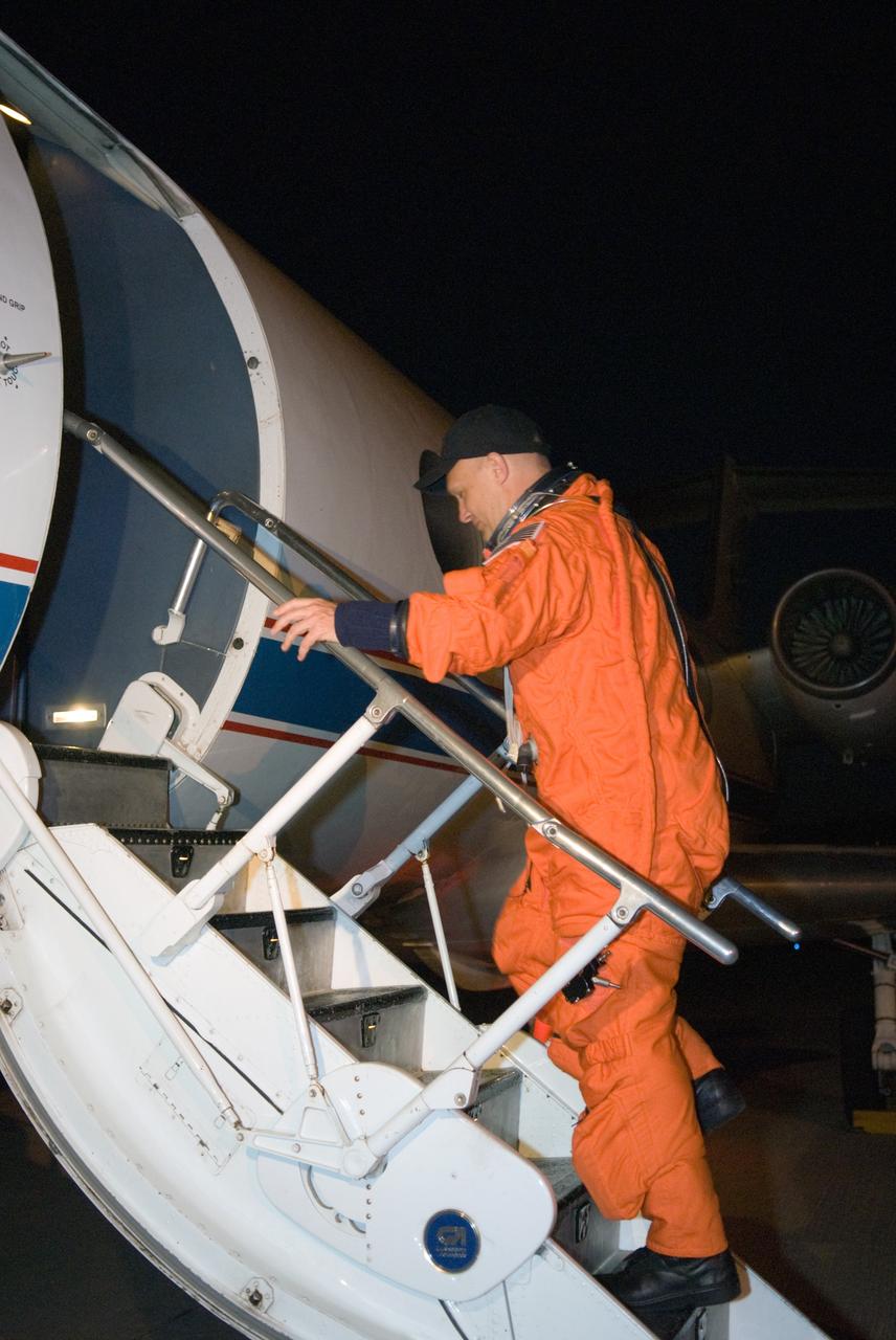 CAPE CANAVERAL, Fla. –  At the Shuttle Landing Facility at NASA's Kennedy Space Center in Florida, STS-127 Pilot Doug Hurley heads into the Shuttle Training Aircraft to practice landings in preparation for launch of space shuttle Endeavour on the STS-127 mission on June 13 to the International Space Station. The STA is a Grumman American Aviation-built Gulfstream II jet that was modified to simulate a shuttle’s cockpit, motion and visual cues, and handling qualities. Endeavour will deliver the Japanese Experiment Module's Exposed Facility, or JEM-EF, and the Experiment Logistics Module-Exposed Section, or ELM-ES. on STS-127. The mission is the final of three flights dedicated to the assembly of the Japan Aerospace Exploration Agency's Kibo laboratory complex on the space station.    Photo credit: NASA/Kim Shiflett
