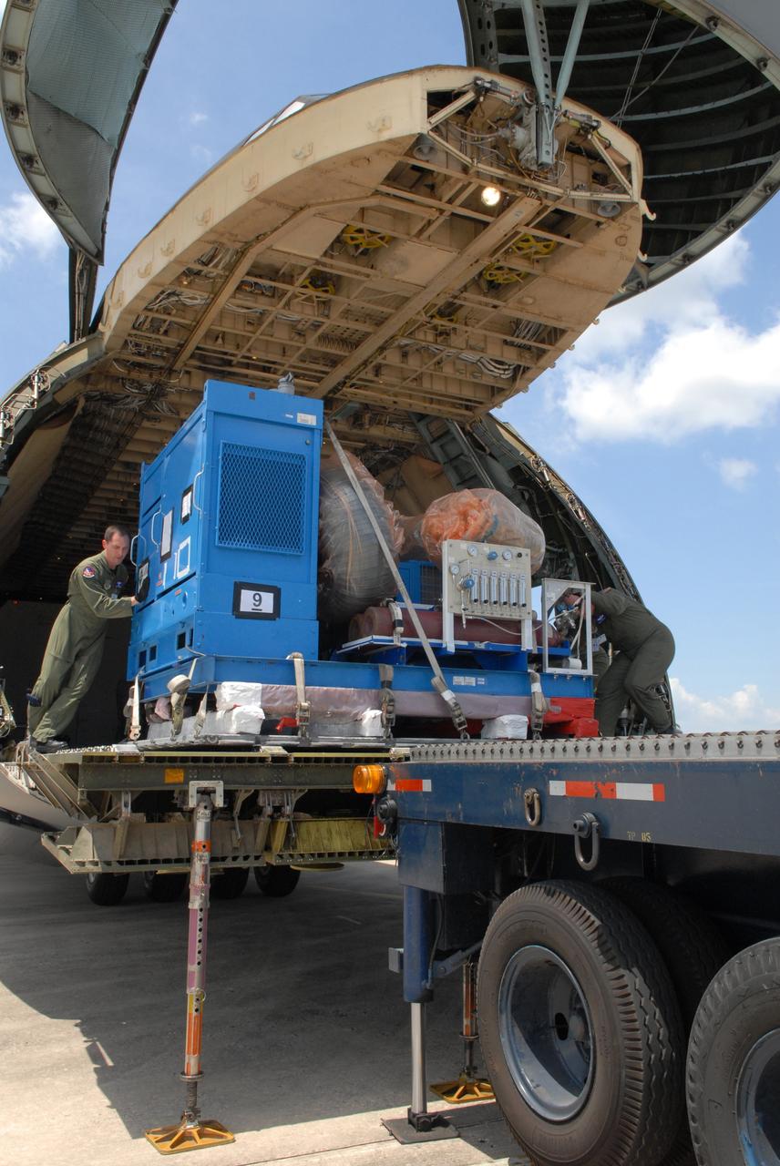 CAPE CANAVERAL, Fla. –  At NASA Kennedy Space Center's Shuttle Landing Facility,  more equipment for the STSS Demonstrator SV-2 spacecraft is offloaded from the U.S. Air Force C-17 aircraft. The spacecraft will be transferred to the Astrotech payload processing facility in Titusville, Fla.The spacecraft is a midcourse tracking technology demonstrator, part of an evolving ballistic missile defense system. STSS is capable of tracking objects after boost phase and provides trajectory information to other sensors. It will be launched by NASA for the Missile Defense Agency in late summer.  Photo credit: NASA/Jack Pfaller  (Approved for Public Release 09-MDA-4616 [27 May 09])