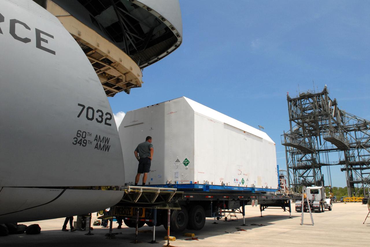 CAPE CANAVERAL, Fla. –  At NASA Kennedy Space Center's Shuttle Landing Facility,  the shipping container with the STSS Demonstrator SV-2spacecraft has been moved out of the U.S. Air Force C-17 aircraft. The spacecraft will be transferred to the Astrotech payload processing facility in Titusville, Fla. The spacecraft is a midcourse tracking technology demonstrator, part of an evolving ballistic missile defense system. STSS is capable of tracking objects after boost phase and provides trajectory information to other sensors. It will be launched by NASA for the Missile Defense Agency in late summer.  Photo credit: NASA/Jack Pfaller  (Approved for Public Release 09-MDA-4616 [27 May 09])