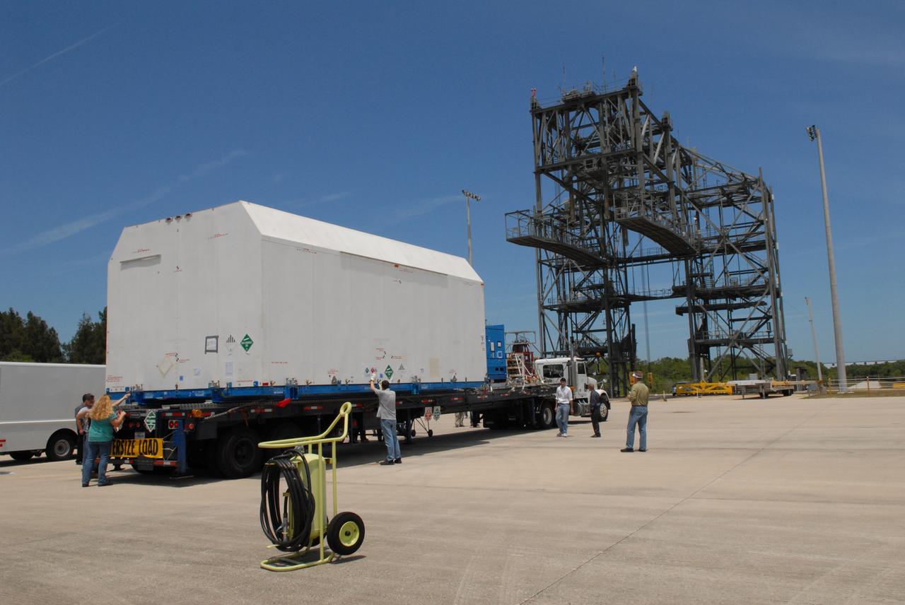 CAPE CANAVERAL, Fla. –  At NASA Kennedy Space Center's Shuttle Landing Facility,  the shipping container with the STSS Demonstrator SV-2spacecraft is secured on a trailer for transfer to the Astrotech payload processing facility in Titusville, Fla.  The spacecraft is a midcourse tracking technology demonstrator, part of an evolving ballistic missile defense system. STSS is capable of tracking objects after boost phase and provides trajectory information to other sensors. It will be launched by NASA for the Missile Defense Agency in late summer.  Photo credit: NASA/Jack Pfaller  (Approved for Public Release 09-MDA-4616 [27 May 09])