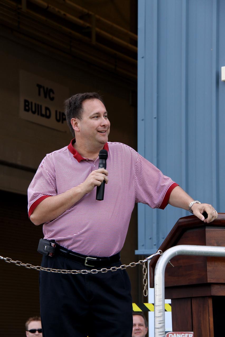 CAPE CANAVERAL, Fla. – At the Assembly and Refurbishment Facility at NASA's Kennedy Space Center in Florida, Robert Lightfoot, acting center director of NASA's Marshall Space Flight Center, speaks to employees who were involved in the processing of the Ares I-X forward assembly (comprising the frustum, forward skirt extension and forward skirt) . The forward assembly is being moved to the Vehicle Assembly Building's High Bay 4 for processing and stacking to the upper stage. Ares I-X is the flight test for the Ares I which will provide NASA an early opportunity to test and prove hardware, facilities and ground operations associated with Ares I, which is part of the Constellation Program to return men to the moon and beyond. Launch of the Ares I-X flight test is targeted for August 2009. Photo credit: NASA/Jack Pfaller