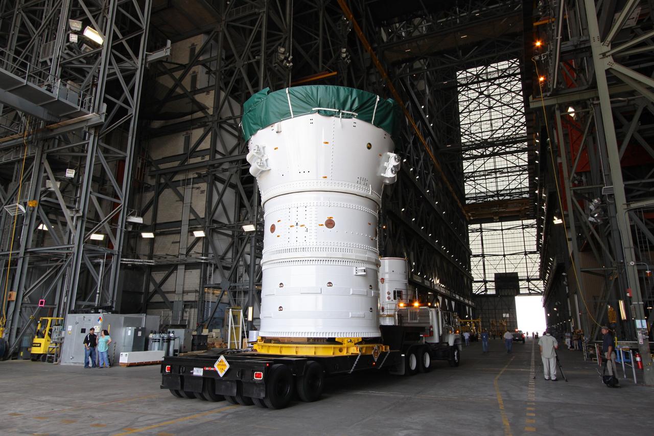 CAPE CANAVERAL, Fla. –  At NASA's Kennedy Space Center in Florida, the Ares I-X forward assembly comprising the frustum, forward skirt extension and forward skirt moves into the transfer aisle of the Vehicle Assembly Building.  The assembly will be placed in the VAB's High Bay 4 where it will undergo processing and stacking to the upper stage.  Ares I-X is the flight test for the Ares I which will provide NASA an early opportunity to test and prove hardware, facilities and ground operations associated with Ares I, which is part of the Constellation Program to return men to the moon and beyond. Launch of the Ares I-X flight test is targeted for August 2009.   Photo credit: NASA/Jack Pfaller