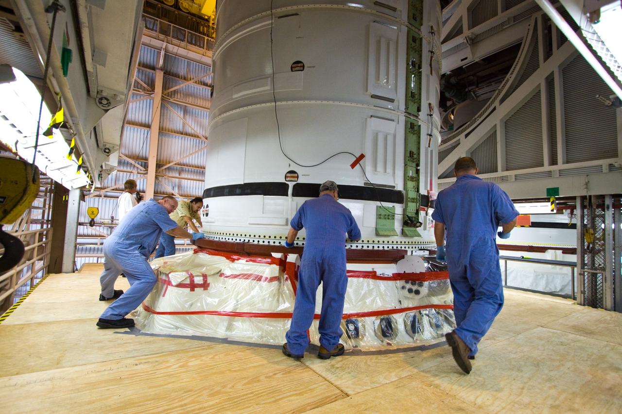 CAPE CANAVERAL, Fla. –  In the Rotation, Processing, and  Surge Facility at NASA's Kennedy Space Center in Florida, the Ares I-X aft skirt is mated to the aft segment.  The complete Ares I-X will be assembled in the Vehicle Assembly Building. The launch of Ares I-X is targeted for August 2009.  Photo credit: NASA/Jack Pfaller