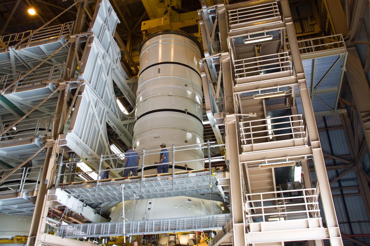 CAPE CANAVERAL, Fla. –  In the Rotation, Processing, and Surge Facility at NASA's Kennedy Space Center in Florida, the Ares I-X aft skirt is mated to the aft segment. The complete Ares I-X will be assembled in the Vehicle Assembly Building. The launch of Ares I-X is targeted for August 2009.  Photo credit: NASA/Jack Pfaller