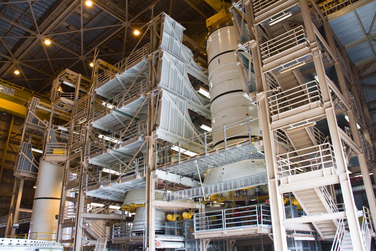 CAPE CANAVERAL, Fla. –  In the Rotation, Processing, and Surge Facility at NASA's Kennedy Space Center in Florida, the Ares I-X aft skirt is mated to the aft segment (at right).  At far left is a solid rocket booster stack for a shuttle.  The launch of Ares I-X is targeted for August 2009.  Photo credit: NASA/Jack Pfaller