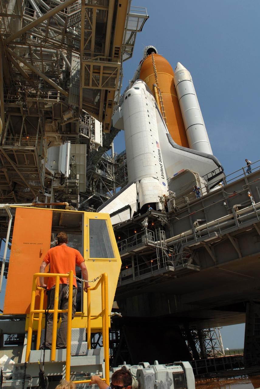 CAPE CANAVERAL, Fla. – On Launch Pad 39A at NASA's Kennedy Space Center in Florida, technicians in the control booth roll the rotating service structure, or RSS, away from space shuttle Endeavour. First motion was at 10:39 a.m. EDT. The rollback is in preparation for Endeavour's liftoff June 13 on the STS-127 mission with a crew of seven. The rotating structure provides protected access to the shuttle for changeout and servicing of payloads at the pad. It is supported by a rotating bridge that pivots on a vertical axis on the west side of the pad's flame trench. After the RSS is rolled back, the orbiter is ready for fuel cell activation and external tank cryogenic propellant loading operations. The launch will be Endeavour's 23rd flight. The shuttle will carry the Japanese Experiment Module's Exposed Facility, or JEM-EF, and the Experiment Logistics Module-Exposed Section, or ELM-ES, on STS-127. The mission is the final of three flights dedicated to the assembly of the Japan Aerospace Exploration Agency's Kibo laboratory complex on the space station. Endeavour's launch is scheduled for June 13 at 7:17 a.m. EDT. Photo credit: NASA/Jim Grossmann