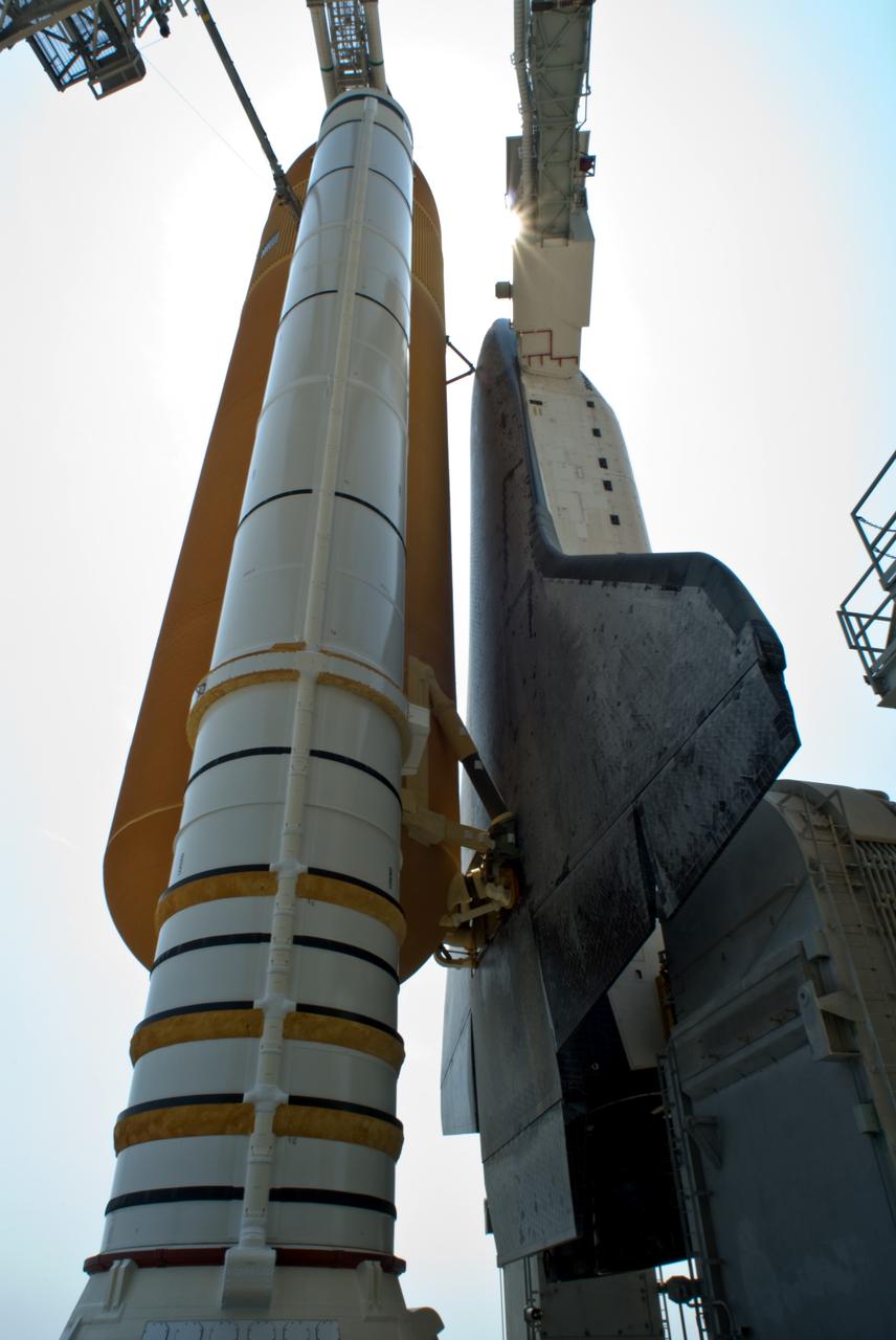 CAPE CANAVERAL, Fla. – Visible after rollback of the rotating service structure and looming like giants against the sky are the solid rocket boosters, external tank and space shuttle Endeavour, poised for launch on Launch Pad 39A at NASA's Kennedy Space Center in Florida. Near the top of Endeavour is the White Room, at the end of the orbiter access arm. The White Room provides entry into the shuttle for the astronauts. The rollback is preparation for Endeavour's liftoff June 13 on the STS-127 mission with a crew of seven. First motion was at 10:39 a.m. EDT and completed at 11:18 a.m. The rotating structure provides protected access to the shuttle for changeout and servicing of payloads at the pad. It is supported by a rotating bridge that pivots on a vertical axis on the west side of the pad's flame trench. After the RSS is rolled back, the orbiter is ready for fuel cell activation and external tank cryogenic propellant loading operations. The launch will be Endeavour's 23rd flight. The shuttle will carry the Japanese Experiment Module's Exposed Facility, or JEM-EF, and the Experiment Logistics Module-Exposed Section, or ELM-ES, on STS-127. The mission is the final of three flights dedicated to the assembly of the Japan Aerospace Exploration Agency's Kibo laboratory complex on the space station. Endeavour's launch is scheduled for June 13 at 7:17 a.m. EDT. Photo credit: NASA/Jim Grossmann