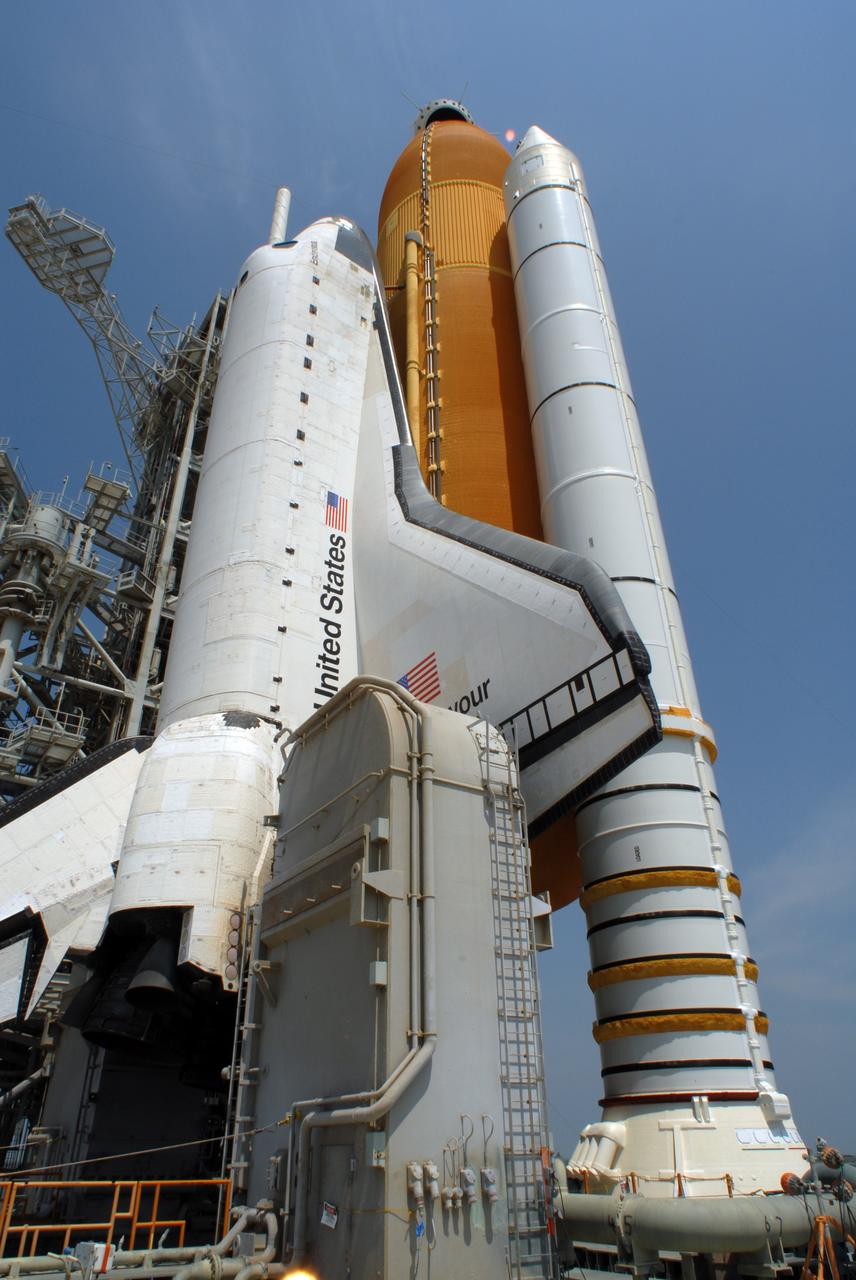 CAPE CANAVERAL, Fla. – After rollback of the rotating service structure on Launch Pad 39A at NASA's Kennedy Space Center in Florida, space shuttle Endeavour, with its external fuel tank and solid rocket boosters, are poised for launch. The rollback is preparation for Endeavour's liftoff June 13 on the STS-127 mission with a crew of seven. First motion was at 10:39 a.m. EDT and completed at 11:18 a.m. The rotating structure provides protected access to the shuttle for changeout and servicing of payloads at the pad. It is supported by a rotating bridge that pivots on a vertical axis on the west side of the pad's flame trench. After the RSS is rolled back, the orbiter is ready for fuel cell activation and external tank cryogenic propellant loading operations. The launch will be Endeavour's 23rd flight. The shuttle will carry the Japanese Experiment Module's Exposed Facility, or JEM-EF, and the Experiment Logistics Module-Exposed Section, or ELM-ES, on STS-127. The mission is the final of three flights dedicated to the assembly of the Japan Aerospace Exploration Agency's Kibo laboratory complex on the space station. Endeavour's launch is scheduled for June 13 at 7:17 a.m. EDT. Photo credit: NASA/Jim Grossmann