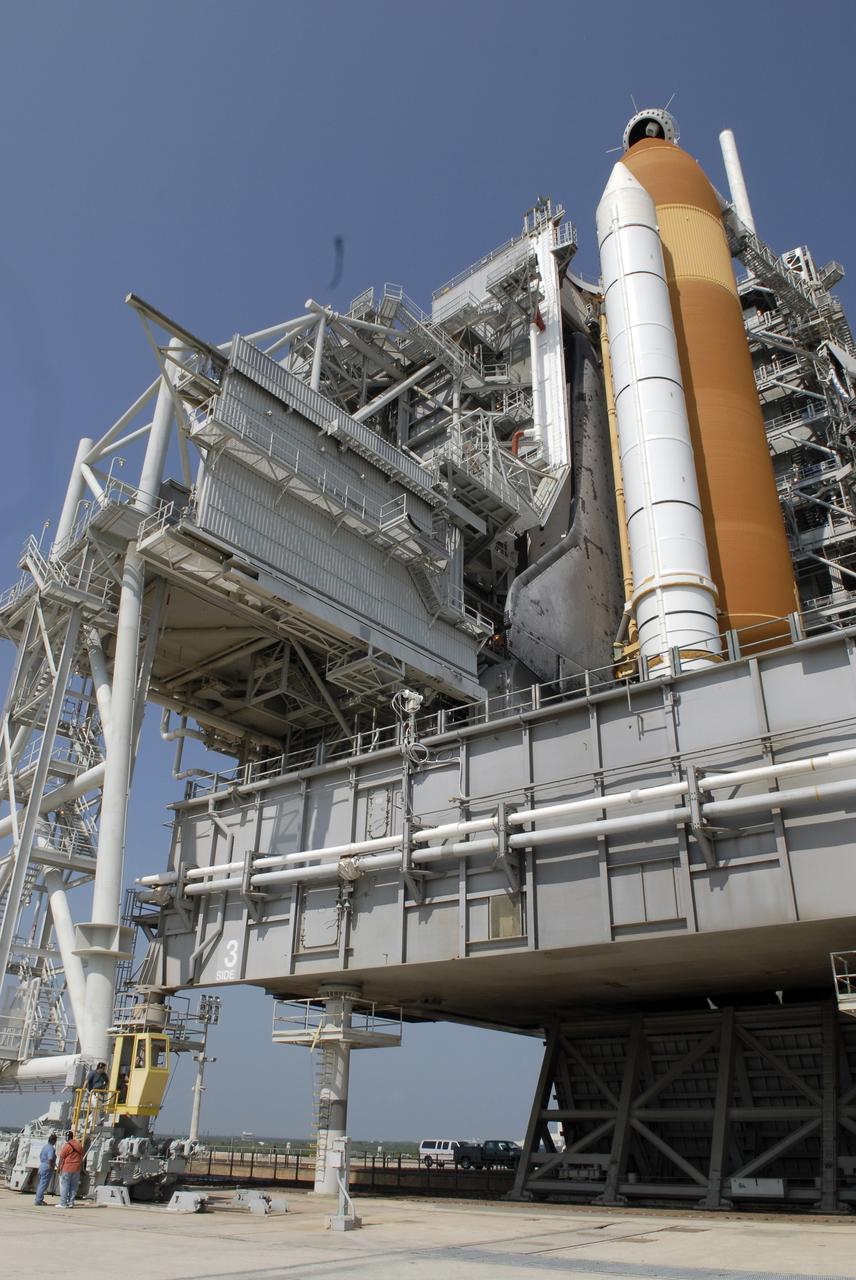 CAPE CANAVERAL, Fla. –  On Launch Pad 39A at NASA's Kennedy Space Center in Florida, technicians in the control booth (lower left) get ready to roll away the rotating service structure, or RSS, above them from space shuttle Endeavour. First motion was at 10:15 a.m. EDT. The rollback is in preparation for Endeavour's liftoff on the STS-127 mission with a crew of seven. This is the second launch attempt for Endeavour after the June 13 launch was scrubbed due to a hydrogen leak at the Ground Umbilical Carrier Plate during tanking June 12.  The launch will be Endeavour's 23rd flight. The shuttle will carry the Japanese Experiment Module's Exposed Facility, or JEM-EF, and the Experiment Logistics Module-Exposed Section, or ELM-ES, on STS-127. The mission is the final of three flights dedicated to the assembly of the Japan Aerospace Exploration Agency's Kibo laboratory complex on the space station. Endeavour's launch is scheduled for June 17 at 5:40 a.m. EDT.  Photo credit: NASA/Kim Shiflett