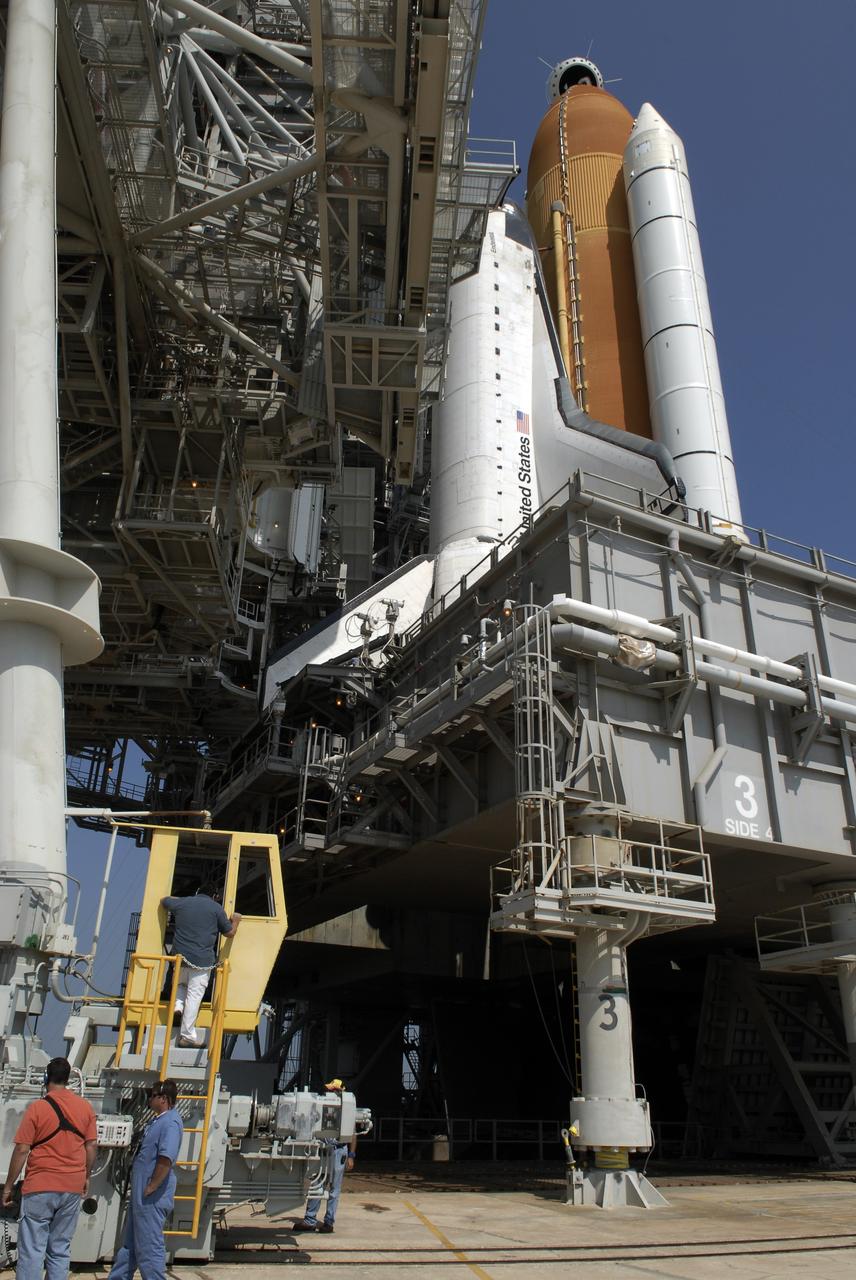 CAPE CANAVERAL, Fla. –  On Launch Pad 39A at NASA's Kennedy Space Center in Florida, technicians in the control booth (lower left) begin to roll away the rotating service structure, or RSS, from space shuttle Endeavour. First motion was at 10:15 a.m. EDT. The rollback is in preparation for Endeavour's liftoff on the STS-127 mission with a crew of seven.  This is the second launch attempt for Endeavour after the June 13 launch was scrubbed due to a hydrogen leak at the Ground Umbilical Carrier Plate during tanking June 12.  The launch will be Endeavour's 23rd flight. The shuttle will carry the Japanese Experiment Module's Exposed Facility, or JEM-EF, and the Experiment Logistics Module-Exposed Section, or ELM-ES, on STS-127. The mission is the final of three flights dedicated to the assembly of the Japan Aerospace Exploration Agency's Kibo laboratory complex on the space station. Endeavour's launch is scheduled for June 17 at 5:40 a.m. EDT.  Photo credit: NASA/Kim Shiflett