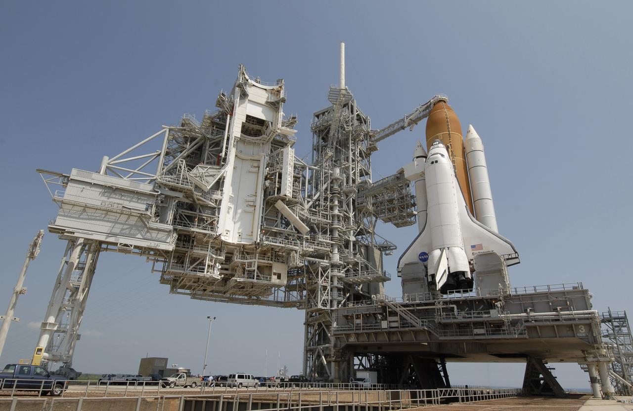 CAPE CANAVERAL, Fla. –  After rollback of the rotating service structure, or RSS, on Launch Pad 39A at NASA's Kennedy Space Center in Florida, space shuttle Endeavour waits for launch.  First motion of the RSS was at 10:15 a.m. EDT. The rollback is in preparation for Endeavour's liftoff on the STS-127 mission with a crew of seven.  This is the second launch attempt for Endeavour after the June 13 launch was scrubbed due to a hydrogen leak at the Ground Umbilical Carrier Plate during tanking June 12.  The launch will be Endeavour's 23rd flight. The shuttle will carry the Japanese Experiment Module's Exposed Facility, or JEM-EF, and the Experiment Logistics Module-Exposed Section, or ELM-ES, on STS-127. The mission is the final of three flights dedicated to the assembly of the Japan Aerospace Exploration Agency's Kibo laboratory complex on the space station. Endeavour's launch is scheduled for June 17 at 5:40 a.m. EDT.  Photo credit: NASA/Kim Shiflett