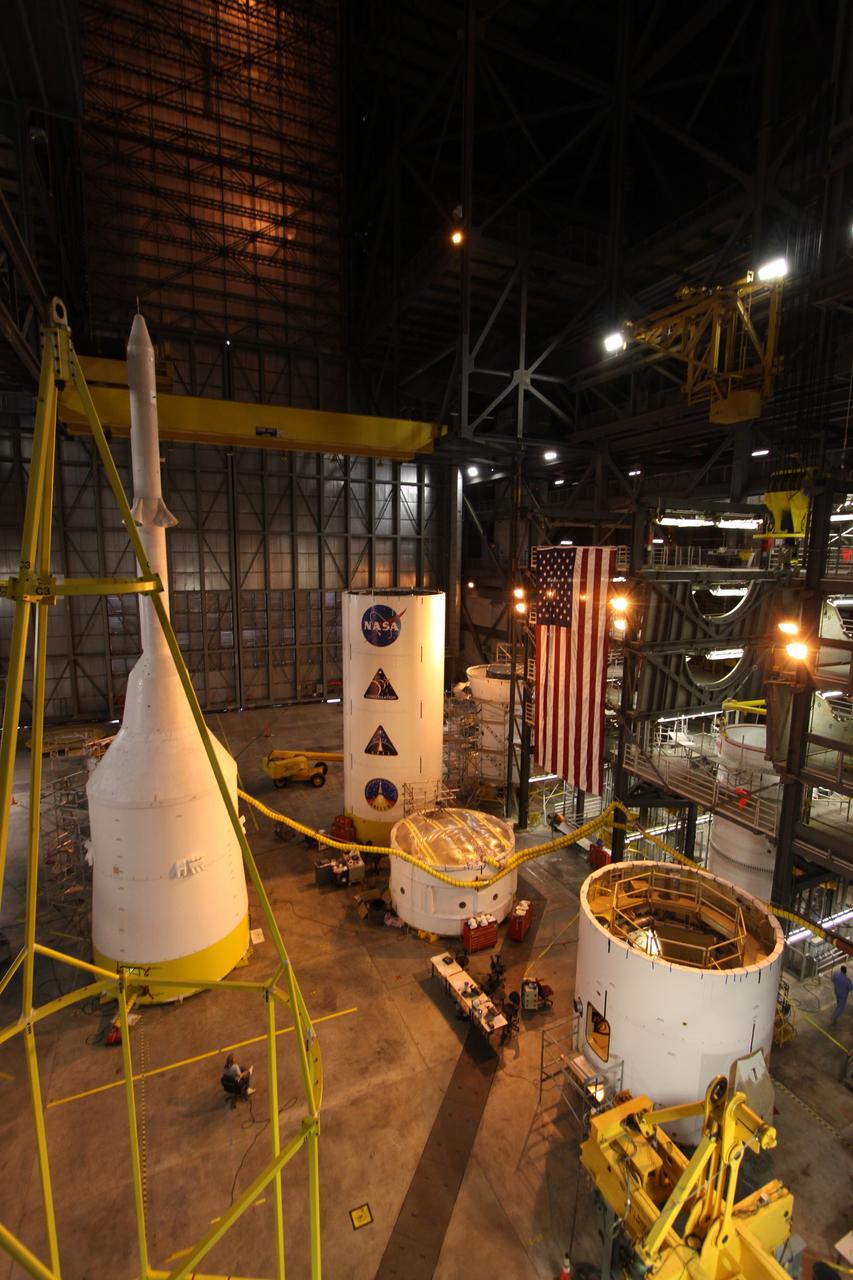 CAPE CANAVERAL, Fla. – In the Vehicle Assembly Building at NASA's Kennedy Space Center in Florida, the Ares I-X fifth segment simulator assembly (center right) joins other segments located in High Bay 4. Ares I-X is the flight test vehicle for the Ares I, the essential core of a safe, reliable, cost-effective space transportation system that eventually will carry crewed missions back to the moon, on to Mars and out into the solar system. Ares I-X is targeted for launch in August 2009. Photo credit: NASA/Kim Shiflett
