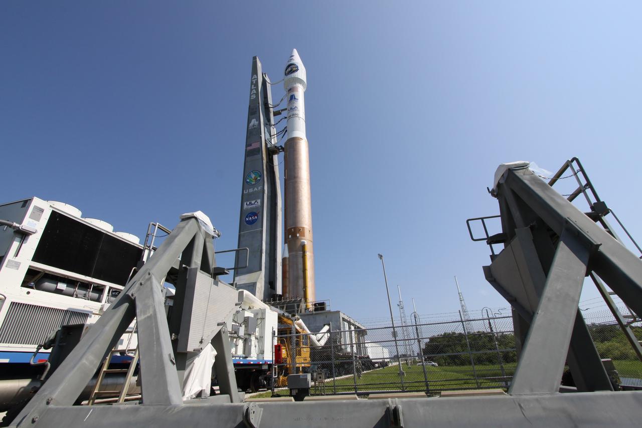 CAPE CANAVERAL, Fla. –   On Launch Complex-41 on Cape Canaveral Air Force Station in Florida, NASA's Lunar Reconnaissance Orbiter, or LRO, and NASA's Lunar Crater Observation and Sensing Satellite, known as LCROSS, and launch gantry roll out to the launch pad.  The satellites are atop their launch vehicle, the Atlas V/Centaur rocket.  LRO and LCROSS are the first missions in NASA's plan to return humans to the moon and begin establishing a lunar outpost by 2020. The LRO also includes seven instruments that will help NASA characterize the moon's surface:  DIVINER, LAMP, LEND, LOLA, CRATER, Mini-RF and LROC.  Launch is scheduled for 5:22 p.m. EDT June 18 . Photo credit: NASA/Jack Pfaller