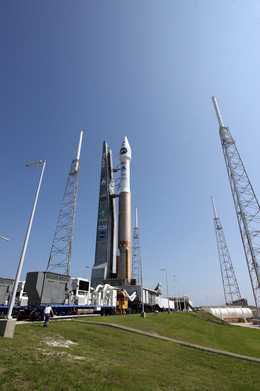 CAPE CANAVERAL, Fla. –   On Launch Complex-41 on Cape Canaveral Air Force Station in Florida, the Atlas V/Centaur rocket with NASA's Lunar Reconnaissance Orbiter, or LRO, and NASA's Lunar Crater Observation and Sensing Satellite, known as LCROSS, on top reach the launch pad.  Circling the pad are the protective lightning towers.  LRO and LCROSS are the first missions in NASA's plan to return humans to the moon and begin establishing a lunar outpost by 2020. The LRO also includes seven instruments that will help NASA characterize the moon's surface:  DIVINER, LAMP, LEND, LOLA, CRATER, Mini-RF and LROC.   Launch is scheduled for 5:22 p.m. EDT June 18 . Photo credit: NASA/Jack Pfaller