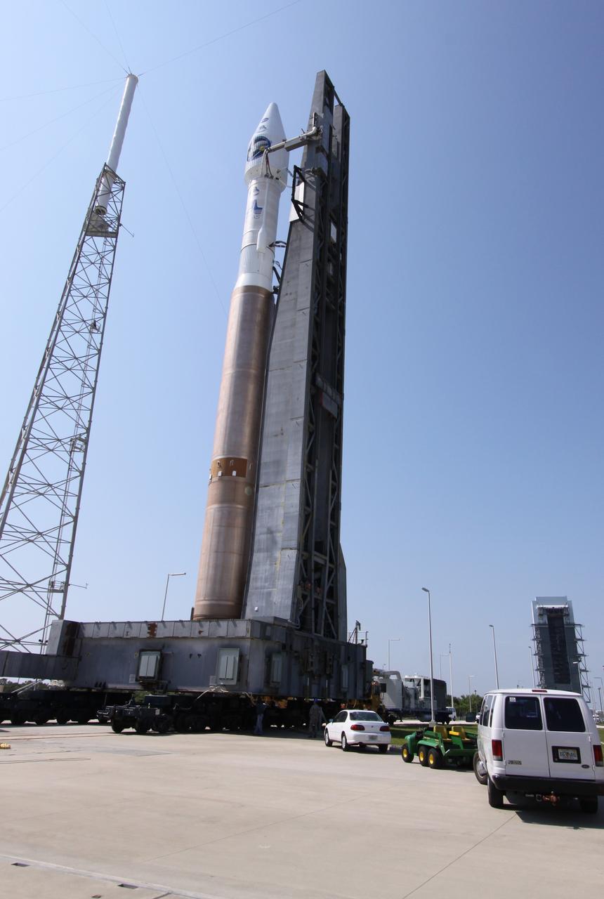 CAPE CANAVERAL, Fla. –   On Launch Complex-41 on Cape Canaveral Air Force Station in Florida, the Atlas V/Centaur rocket with NASA's Lunar Reconnaissance Orbiter, or LRO, and NASA's Lunar Crater Observation and Sensing Satellite, known as LCROSS, on top reach the launch pad.  Circling the pad are the protective lightning towers.  LRO and LCROSS are the first missions in NASA's plan to return humans to the moon and begin establishing a lunar outpost by 2020. The LRO also includes seven instruments that will help NASA characterize the moon's surface:  DIVINER, LAMP, LEND, LOLA, CRATER, Mini-RF and LROC.   Launch is scheduled for 5:22 p.m. EDT June 18 . Photo credit: NASA/Jack Pfaller