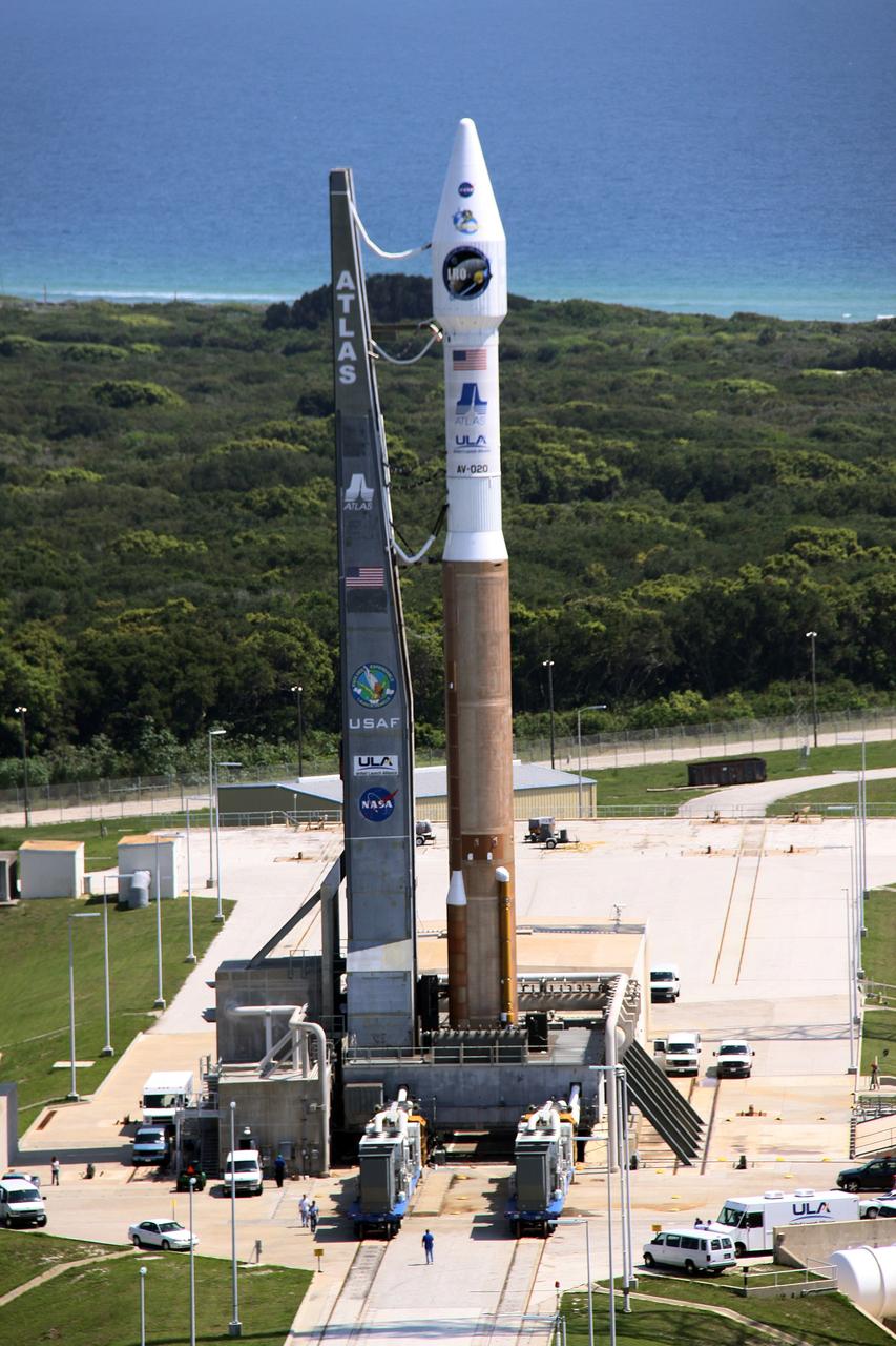 CAPE CANAVERAL, Fla. –   The Atlas V/Centaur rocket with NASA's Lunar Reconnaissance Orbiter, or LRO, and NASA's Lunar Crater Observation and Sensing Satellite, known as LCROSS, on top are on the pad at Launch Complex-41 on Cape Canaveral Air Force Station in Florida. LRO and LCROSS are the first missions in NASA's plan to return humans to the moon and begin establishing a lunar outpost by 2020. The LRO also includes seven instruments that will help NASA characterize the moon's surface:  DIVINER, LAMP, LEND, LOLA, CRATER, Mini-RF and LROC.   Launch is scheduled for 5:22 p.m. EDT June 18 . Photo credit: NASA/Jack Pfaller