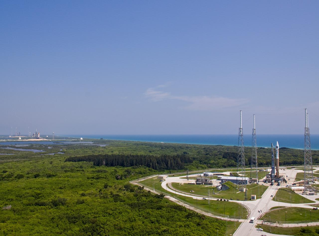 CAPE CANAVERAL, Fla. –   A wide view captures both Launch Complex-41 on Cape Canaveral Air Force Station at right and Launch Pad 39A at NASA's Kennedy Space Center in Florida at left.  Space shuttle Endeavour is still on the pad after launch was officially scrubbed at 1:55 a.m. this morning when a gaseous hydrogen leak occurred at the Ground Umbilical Carrier Plate.  NASA's Lunar Reconnaissance Orbiter, or LRO, and NASA's Lunar Crater Observation and Sensing Satellite, known as LCROSS, are on Complex 41 waiting for launch on the Atlas V/Centaur rocket.   LRO and LCROSS are the first missions in NASA's plan to return humans to the moon and begin establishing a lunar outpost by 2020. The LRO also includes seven instruments that will help NASA characterize the moon's surface:  DIVINER, LAMP, LEND, LOLA, CRATER, Mini-RF and LROC.   Launch is scheduled for 5:22 p.m. EDT June 18 . Photo credit: NASA/Jack Pfaller