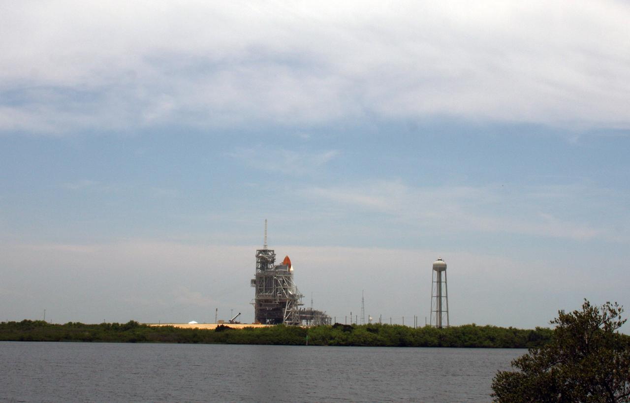 CAPE CANAVERAL, Fla. – The rotating service structure is closed around space shuttle Endeavour on Launch Pad 39A at NASA's Kennedy Space Center in Florida after its launch for the STS-127 mission was scrubbed at 1:55 a.m. EDT June 17 due to a gaseous hydrogen leak at the Ground Umbilical Carrier Plate. Endeavour’s next launch attempt for the mission is targeted for July 11 at 7:39 p.m. EDT. Photo credit: NASA/Ken Thornsley