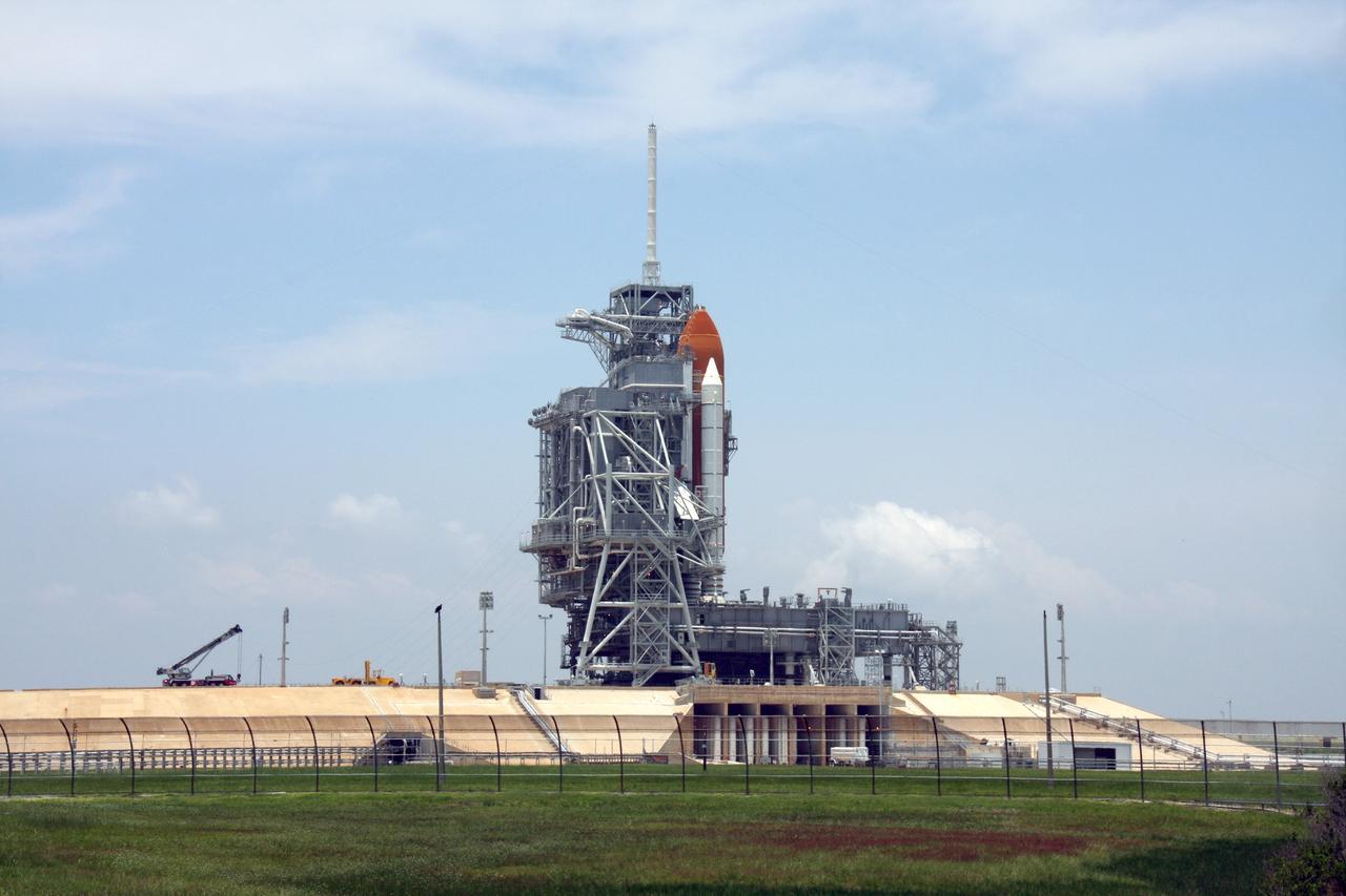 CAPE CANAVERAL, Fla. – The rotating service structure is closed around space shuttle Endeavour on Launch Pad 39A at NASA's Kennedy Space Center in Florida after its launch for the STS-127 mission was scrubbed at 1:55 a.m. EDT June 17 due to a gaseous hydrogen leak at the Ground Umbilical Carrier Plate. Endeavour’s next launch attempt for the mission is targeted for July 11 at 7:39 p.m. EDT. Photo credit: NASA/Ken Thornsley
