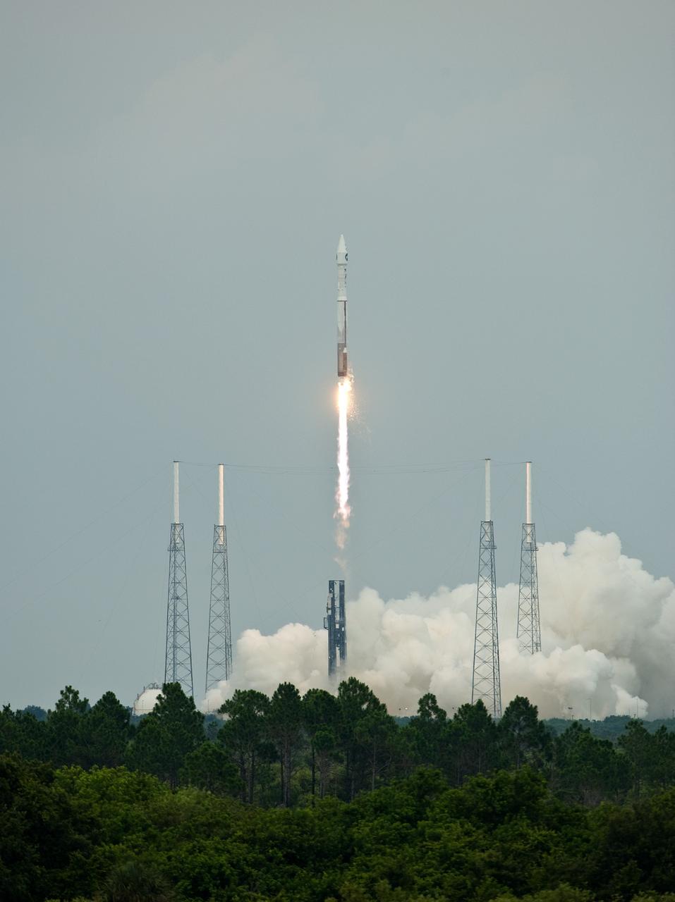 CAPE CANAVERAL, Fla. – Smoke fills the pad and trails behind the Atlas V/Centaur rocket as it roars into space carrying NASA's Lunar Reconnaissance Orbiter, or LRO, and NASA's Lunar Crater Observation and Sensing Satellite, known as LCROSS. Surrounding the pad are lightning towers.  LRO and LCROSS are the first missions in NASA's plan to return humans to the moon and begin establishing a lunar outpost by 2020. The LRO also includes seven instruments that will help NASA characterize the moon's surface:  DIVINER, LAMP, LEND, LOLA , CRATER, Mini-RF and LROC.   Launch was on-time at 5:32 p.m. EDT June 18.  Photo credit: NASA/Tom Farrar