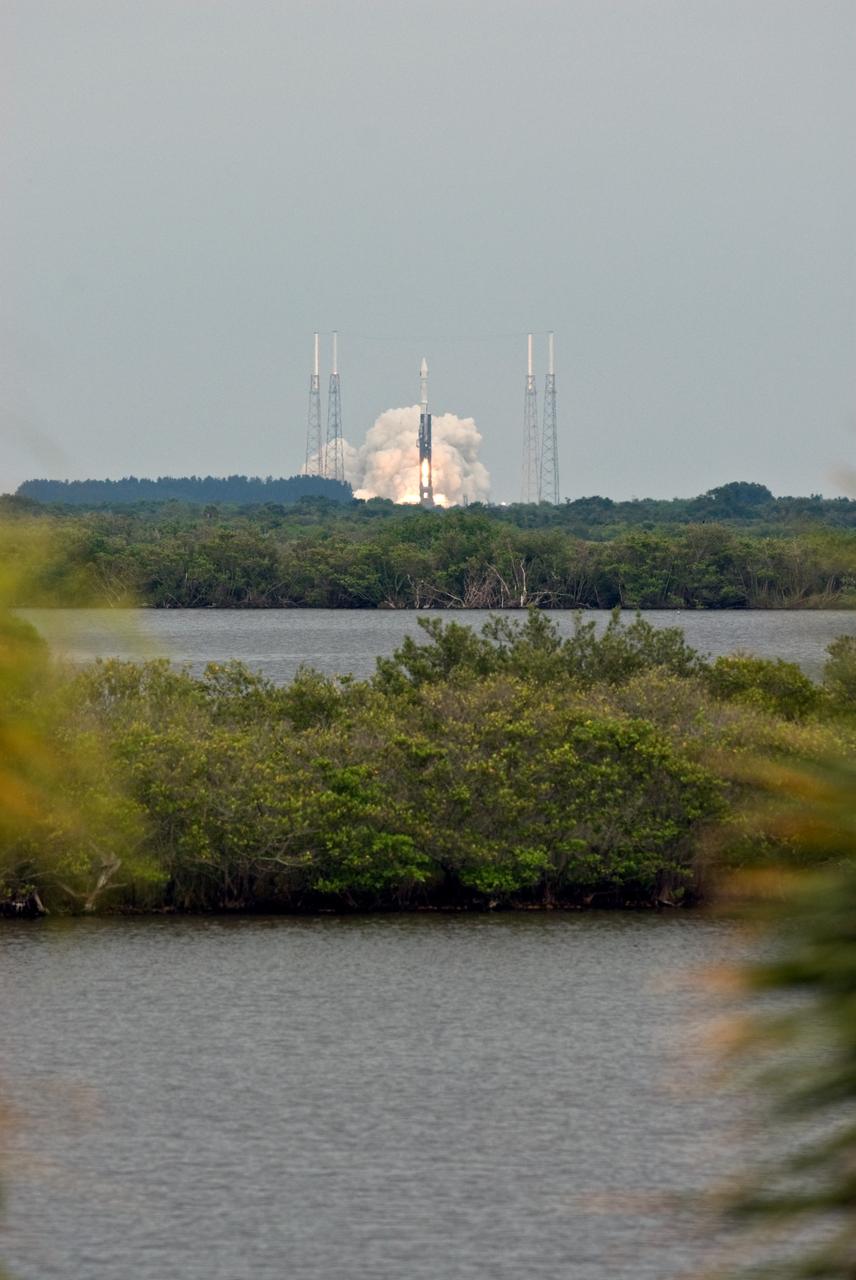 CAPE CANAVERAL, Fla. – Viewed across the Indian River Lagoon, the Atlas V/Centaur rocket carrying NASA's Lunar Reconnaissance Orbiter, or LRO, and NASA's Lunar Crater Observation and Sensing Satellite, known as LCROSS, lifts off from Launch Complex 41 at Cape Canaveral Air Force Station in Florida.  Surrounding the pad are lightning towers.  LRO and LCROSS are the first missions in NASA's plan to return humans to the moon and begin establishing a lunar outpost by 2020. The LRO also includes seven instruments that will help NASA characterize the moon's surface:  DIVINER, LAMP, LEND, LOLA , CRATER, Mini-RF and LROC.   Launch was on-time at 5:32 p.m. EDT June 18.  Photo credit: NASA/Tony Gray