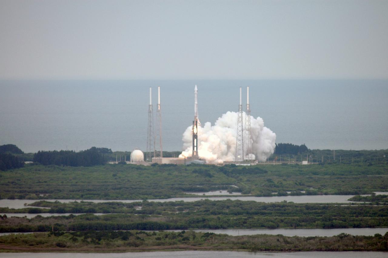 CAPE CANAVERAL, Fla. – On Launch Complex 41 at Cape Canaveral Air Force Station in Florida, bursts of smoke and steam signal liftoff for the Atlas V/Centaur rocket carrying NASA's Lunar Reconnaissance Orbiter, or LRO, and NASA's Lunar Crater Observation and Sensing Satellite, known as LCROSS, toward space.  Surrounding the pad are lightning towers.  LRO and LCROSS are the first missions in NASA's plan to return humans to the moon and begin establishing a lunar outpost by 2020. The LRO also includes seven instruments that will help NASA characterize the moon's surface:  DIVINER, LAMP, LEND, LOLA , CRATER, Mini-RF and LROC.   Launch was on-time at 5:32 p.m. EDT June 18.  Photo credit: NASA/Jeffery Marino