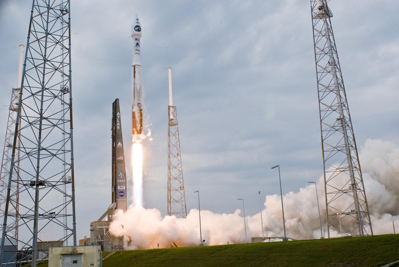 CAPE CANAVERAL, Fla. – Smoke pours across Launch Complex 41 at Cape Canaveral Air Force Station in Florida as the Atlas V/Centaur carrying NASA's Lunar Reconnaissance Orbiter, or LRO, and NASA's Lunar Crater Observation and Sensing Satellite, known as LCROSS, roars into the sky.  The towers around the pad are part of the lightning protection system.  LRO and LCROSS are the first missions in NASA's plan to return humans to the moon and begin establishing a lunar outpost by 2020. The LRO also includes seven instruments that will help NASA characterize the moon's surface:  DIVINER, LAMP, LEND, LOLA , CRATER, Mini-RF and LROC.  Launch was on-time at 5:32 p.m. EDT.  Photo credit: NASA/Tom Farrar, Kevin O'Connell