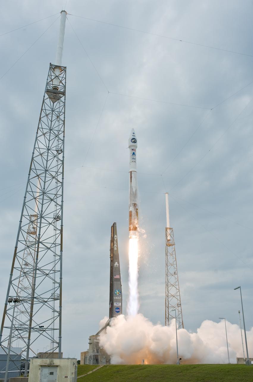 CAPE CANAVERAL, Fla. – Smoke pours across Launch Complex 41 at Cape Canaveral Air Force Station in Florida as the Atlas V/Centaur carrying NASA's Lunar Reconnaissance Orbiter, or LRO, and NASA's Lunar Crater Observation and Sensing Satellite, known as LCROSS, roars into the sky.  The towers around the pad are part of the lightning protection system.  LRO and LCROSS are the first missions in NASA's plan to return humans to the moon and begin establishing a lunar outpost by 2020. The LRO also includes seven instruments that will help NASA characterize the moon's surface:  DIVINER, LAMP, LEND, LOLA , CRATER, Mini-RF and LROC.  Launch was on-time at 5:32 p.m. EDT.  Photo credit: NASA/Tom Farrar, Kevin O'Connell