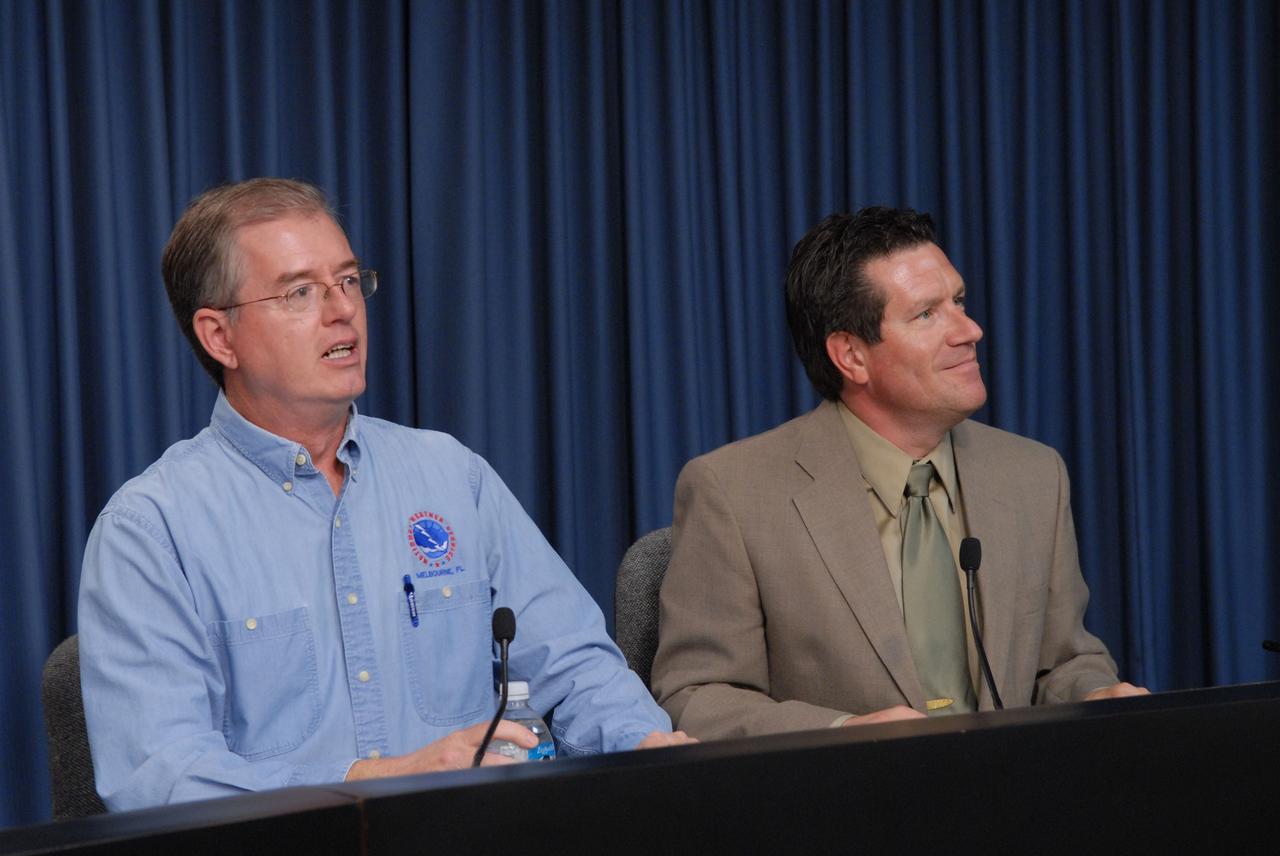 CAPE CANAVERAL, Fla. – Bart Hagemeyer, at left, meteorologist in charge, NOAA National Weather Service forecast office, Melbourne, Fla., and Joel Tumbiolo, Delta IV launch weather officer, 45th Weather Squadron, Cape Canaveral Air Force Station, participate in a prelaunch news conference on the Geostationary Operational Environmental Satellite-O mission in NASA's Kennedy Space Center press site auditorium.    The GOES-O satellite is targeted to launch June 26. The latest Geostationary Operational Environmental Satellite, GOES-O was developed by NASA for the National Oceanic and Atmospheric Administration, or NOAA. Each of the GOES satellites continuously provides observations of 60 percent of the Earth including the continental United States, providing weather monitoring and forecast operations as well as a continuous and reliable stream of environmental information and severe weather warnings. Once in orbit, GOES-O will be designated GOES-14, and NASA will provide on-orbit checkout and then transfer operational responsibility to NOAA.    Photo credit: NASA/Jim Grossmann