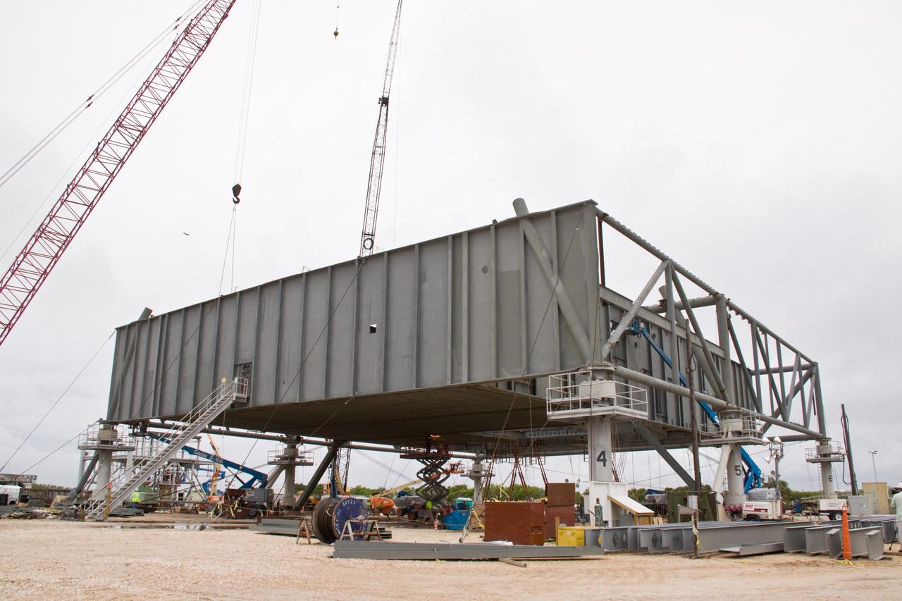 CAPE CANAVERAL, Fla. – At NASA's Kennedy Space Center in Florida, construction is under way on a new mobile launcher for the Constellation Program.  The new mobile launcher will be the base for the Ares rockets to launch the Orion crew exploration vehicle and the cargo vehicle.  The base is being made lighter than space shuttle mobile launcher platforms so the crawler-transporter can pick up the added load of the 345-foot tower and taller rocket.  When the structural portion of the new launcher is complete, umbilical lines, access arms, communications equipment and command/control equipment will be installed.  Photo credit:  Photo credit: NASA/Jack Pfaller