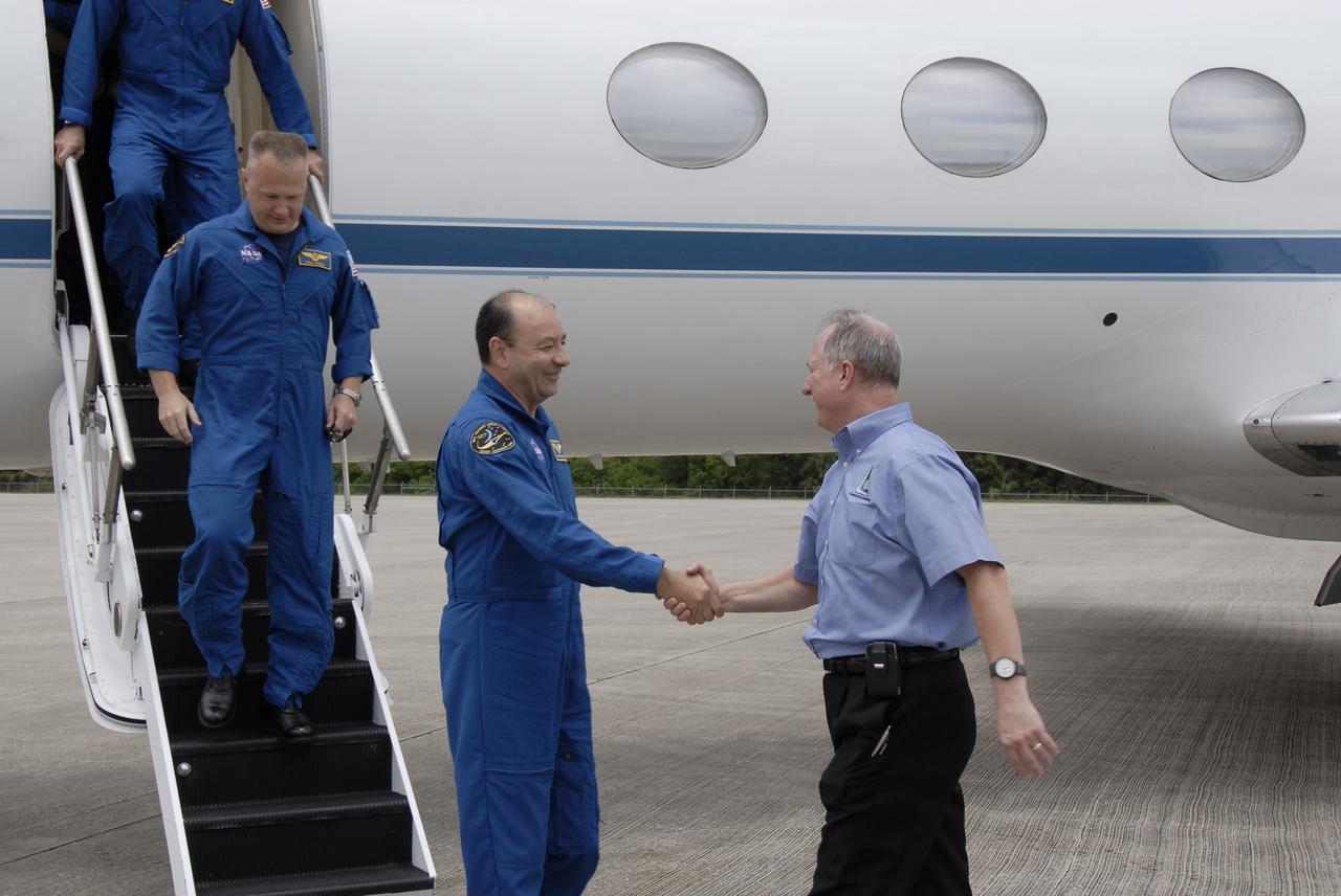 CAPE CANAVERAL, Fla. – – The STS-127 crew members arrive at NASA's Kennedy Space Center in Florida to prepare for space shuttle Endeavour's July 11 launch on the 29th assembly flight to the International Space Station.  Leading the way, Commander Mark Polansky is greeted by the STS-127 Launch Director Pete Nickolenko.  Behind Polansky is Pilot Doug Hurley.  Polansky will be making his third shuttle flight and Hurley his first.  This will be the third launch attempt due to the leak of hydrogen gas at the Ground Umbilical Carrier Plate during tanking on two previous attempts, June 13 and June 17. The STS-127 mission is the final of three flights dedicated to the assembly of the Japan Aerospace Exploration Agency's Kibo laboratory complex. Endeavour will deliver the Japanese Experiment Module's Exposed Facility, or JEM-EF, and the Experiment Logistics Module-Exposed Section, or ELM-ES.  Photo credit: NASA/Kim Shiflett