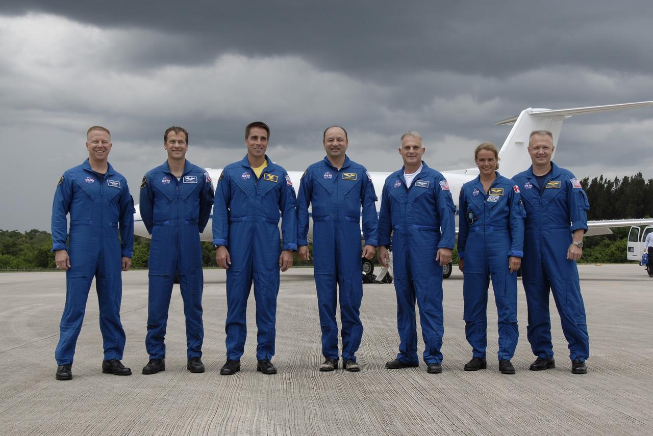 CAPE CANAVERAL, Fla. – After arriving at NASA's Kennedy Space Center in Florida to prepare for space shuttle Endeavour's July 11 launch on the 29th assembly flight to the International Space Station, the STS-127 crew members pose for a final photo before leaving the Shuttle Landing Facility. From left are Mission Specialists Tim Kopra, Tom Marshburn and Christopher Cassidy, Commander Mark Polansky, Mission Specialists Dave Wolf and Julie Payette, and Pilot Doug Hurley. Kopra is making his first shuttle flight and will remain on the International Space Station as the Expedition 20 flight engineer. Payette is with the Canadian Space Agency. This will be the third launch attempt due to the leak of hydrogen gas at the Ground Umbilical Carrier Plate during tanking on two previous attempts, June 13 and June 17. The STS-127 mission is the final of three flights dedicated to the assembly of the Japan Aerospace Exploration Agency's Kibo laboratory complex. Endeavour will deliver the Japanese Experiment Module's Exposed Facility, or JEM-EF, and the Experiment Logistics Module-Exposed Section, or ELM-ES. Photo credit: NASA/Kim Shiflett