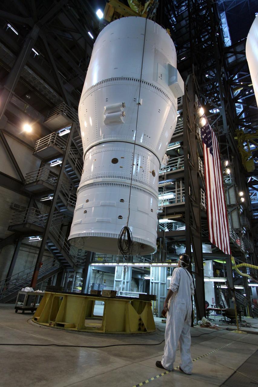 CAPE CANAVERAL, Fla. – In the Vehicle Assembly Building at NASA's Kennedy Space Center in Florida, segments of the Ares I-X first stage are lifted from the stand.  The segments are being moved for stacking and mating to the fifth segment simulator, completing  Super Stack 1.  The super stack comprises the forward skirt, forward skirt extension, interstages 1 and 2 and the fifth segment simulator. Ares I-X is the test vehicle for the Ares I, which is part of the Constellation Program to return men to the moon and beyond.  The Ares I-X flight test is targeted no earlier than Aug. 30 from Launch Pad 39B.  Photo credit: NASA/Jack Pfaller