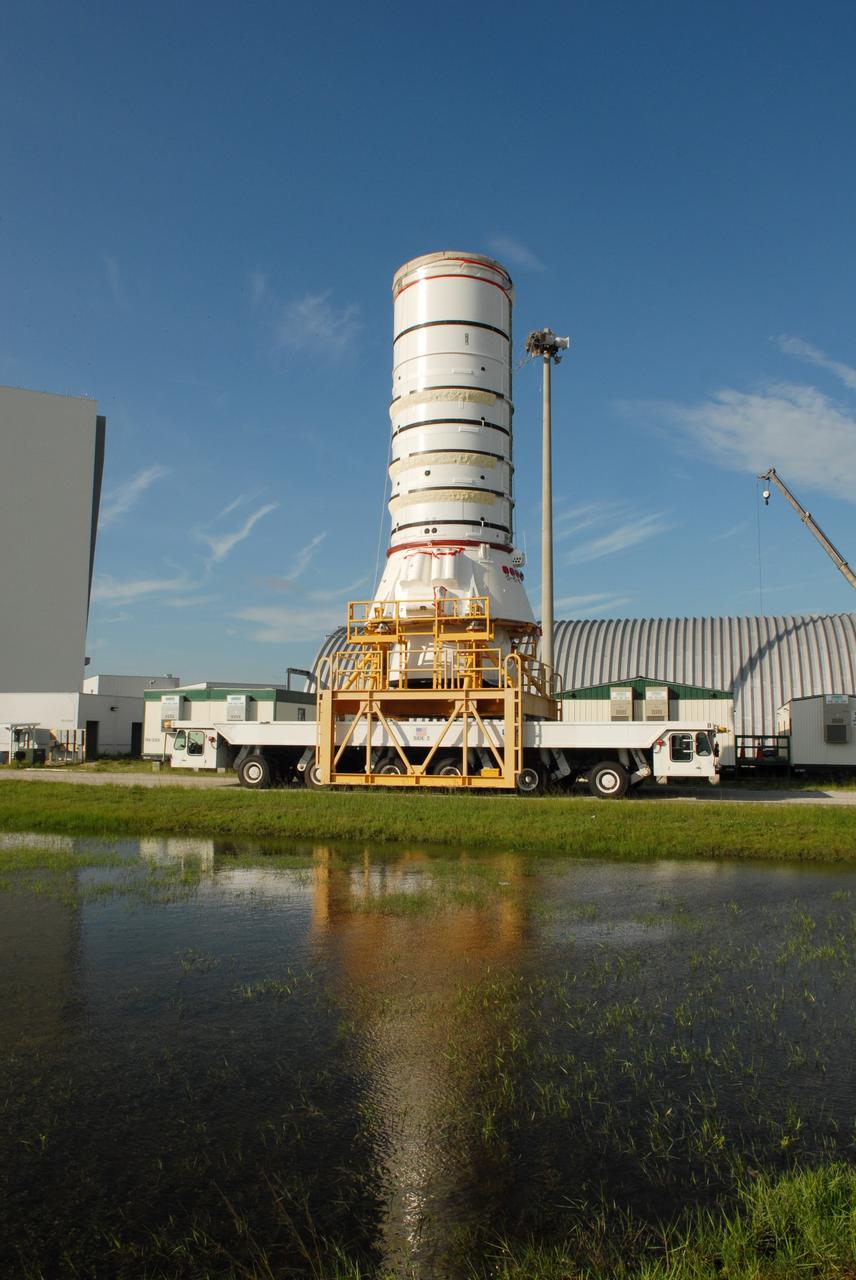 CAPE CANAVERAL, Fla. – The Ares I-X aft assembly moves away from the Rotation, Processing and Surge Facility at NASA's Kennedy Space Center in Florida. It is going to the Vehicle Assembly Building for stacking to complete the Ares I-X test vehicle. The aft assembly will be the first segment to be stacked on the mobile launch platform in the VAB. Part of the Constellation Program, the Ares I-X is the test vehicle for the Ares I, which is the essential core of a space transportation system that eventually will carry crewed missions back to the moon, on to Mars and out into the solar system. The Ares I-X flight test is targeted no earlier than Aug. 30 from Launch Pad 39B. Photo credit: NASA/Jim Grossmann