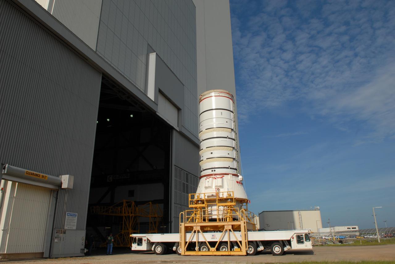CAPE CANAVERAL, Fla. – The Ares I-X aft assembly moves toward the door of the Vehicle Assembly Building at NASA's Kennedy Space Center in Florida. Inside, it will be stacked with other segments to complete the Ares I-X test vehicle. The aft assembly will be the first segment to be stacked on the mobile launch platform in the VAB. Part of the Constellation Program, the Ares I-X is the test vehicle for the Ares I, which is the essential core of a space transportation system that eventually will carry crewed missions back to the moon, on to Mars and out into the solar system. The Ares I-X flight test is targeted no earlier than Aug. 30 from Launch Pad 39B. Photo credit: NASA/Jim Grossmann