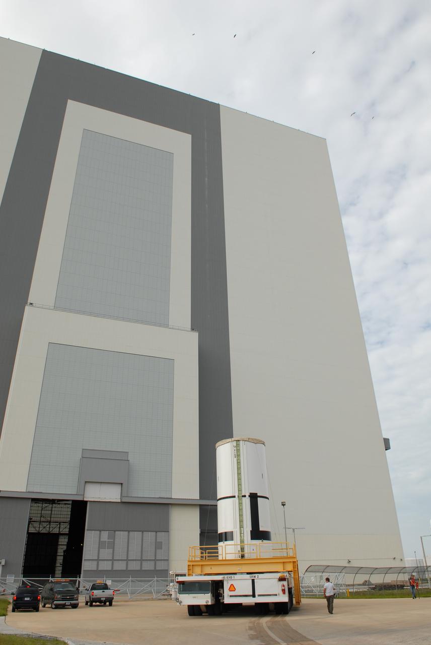 CAPE CANAVERAL, Fla. – The Ares I-X aft center booster segment rolls toward the Vehicle Assembly Building at NASA's Kennedy Space Center in Florida. The Ares I-X launch vehicle segments are being stacked in the VAB. Part of the Constellation Program, the Ares I-X is the test vehicle for the Ares I, which is the essential core of a space transportation system that eventually will carry crewed missions back to the moon, on to Mars and out into the solar system. Launch is targeted for no earlier than Aug. 30 from Launch Pad 39B. Photo credit: NASA/Jim Grossmann