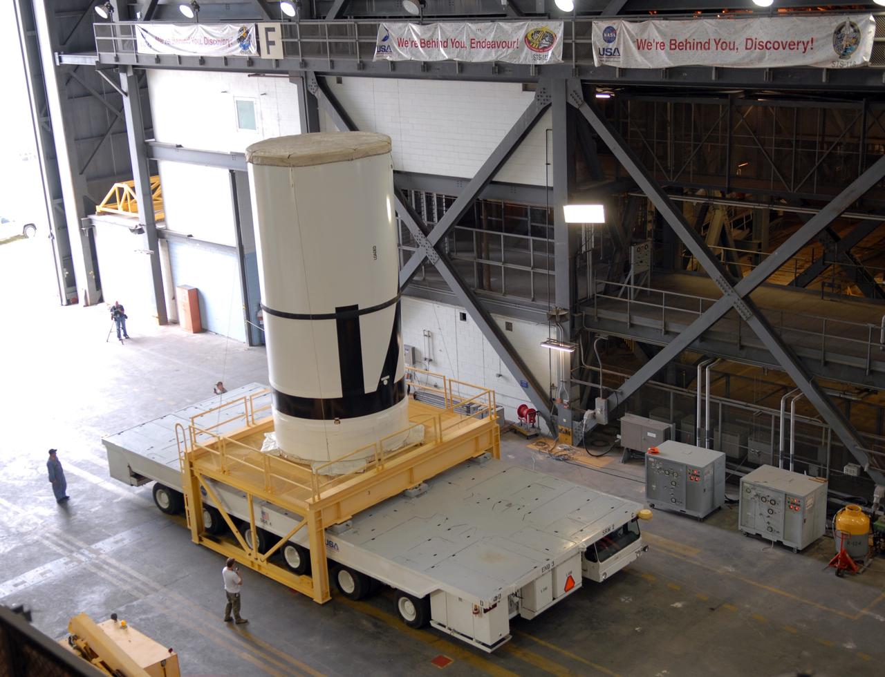 CAPE CANAVERAL, Fla. – The Ares I-X aft center booster segment arrives in the transfer aisle of the Vehicle Assembly Building at NASA's Kennedy Space Center in Florida. The Ares I-X launch vehicle segments are being stacked in the VAB. Part of the Constellation Program, the Ares I-X is the test vehicle for the Ares I, which is the essential core of a space transportation system that eventually will carry crewed missions back to the moon, on to Mars and out into the solar system. Launch is targeted for no earlier than Aug. 30 from Launch Pad 39B. Photo credit: NASA/Jim Grossmann
