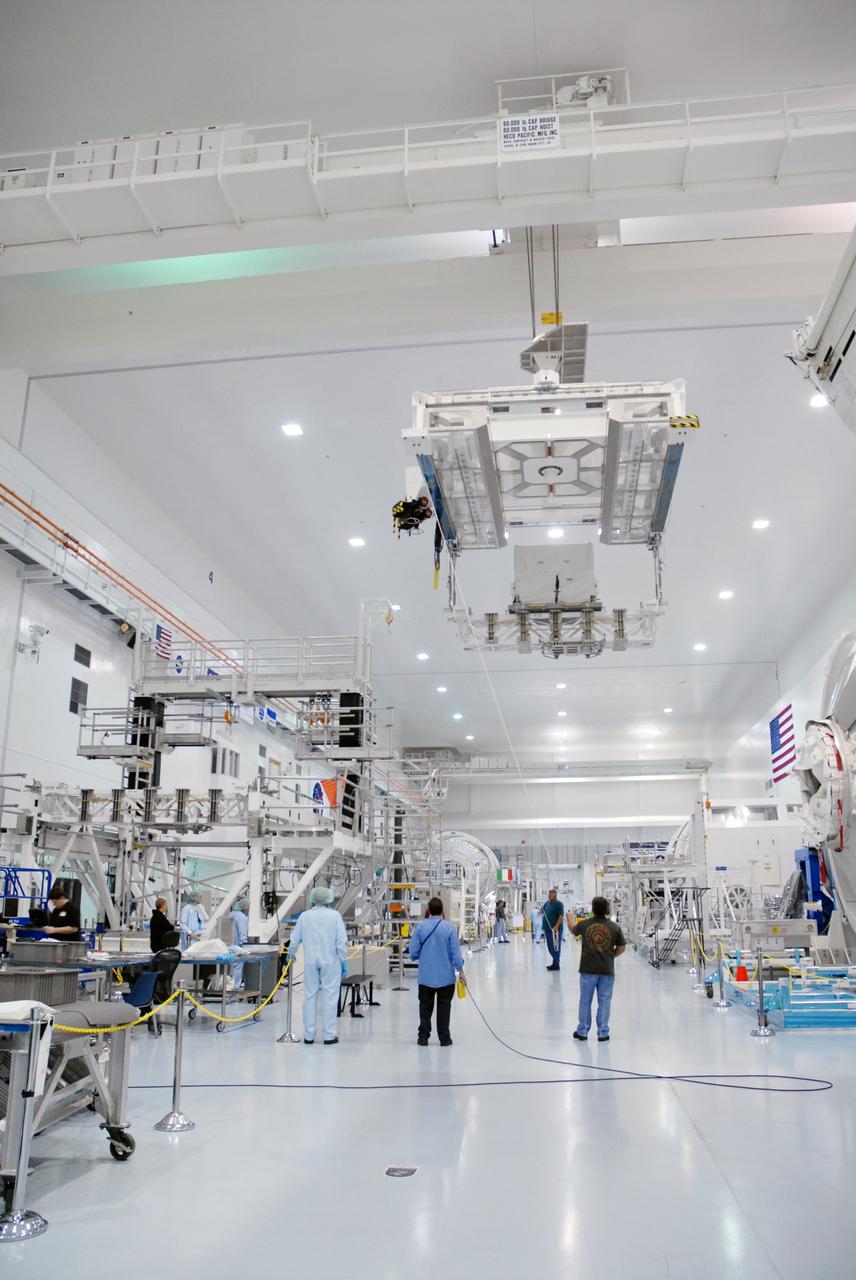 CAPE CANAVERAL, Fla. – In the Space Station Processing Facility at NASA's Kennedy Space Center in Florida, the Lightweight Multi-Purpose Experiment Support Structure Carrier, or LMC, is moved across the facility for weighing and installation in the payload canister. Part of the payload for space shuttle Discovery's STS-128 mission to the International Space Station, the carrier holds an ammonia tank assembly. The STS-128 flight also will carry science and storage racks to the space station on Discovery. Launch of Discovery is targeted for Aug. 18. Photo credit: NASA/Tim Jacobs
