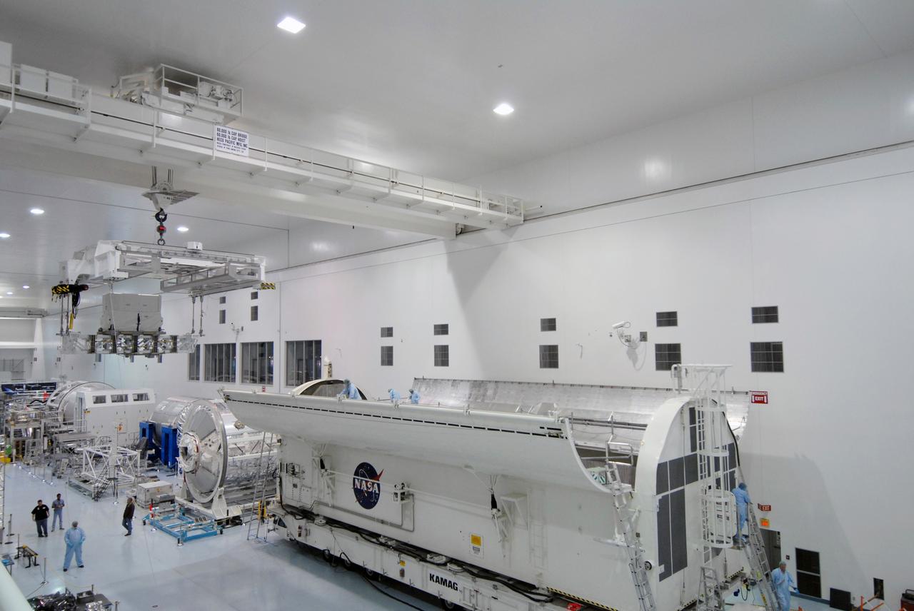 CAPE CANAVERAL, Fla. – In the Space Station Processing Facility at NASA's Kennedy Space Center in Florida, the Lightweight Multi-Purpose Experiment Support Structure Carrier, or LMC, is being moved to the payload canister for installation. Part of the payload for space shuttle Discovery's STS-128 mission to the International Space Station, the carrier holds an ammonia tank assembly. The STS-128 flight also will carry science and storage racks to the space station on Discovery. Launch of Discovery is targeted for Aug. 18. Photo credit: NASA/Tim Jacobs