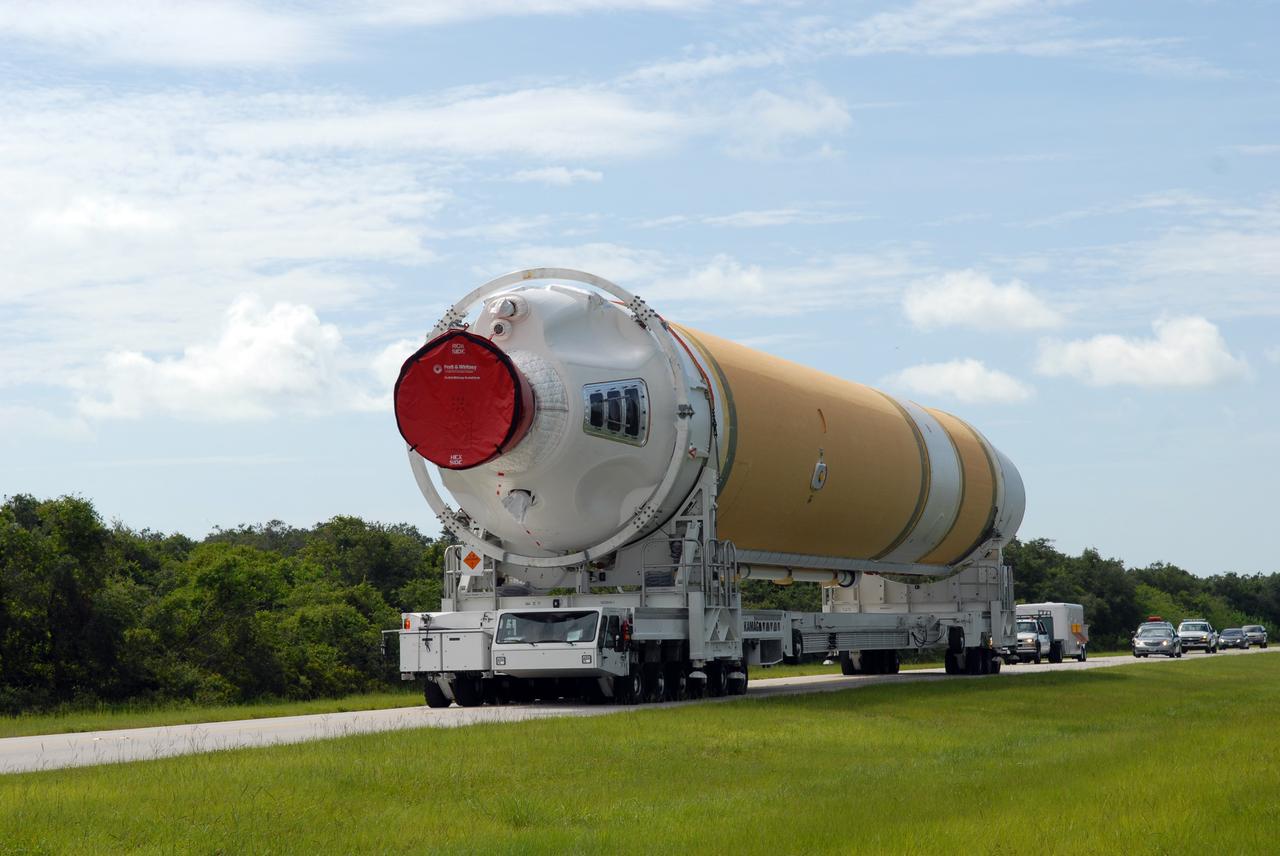 CAPE CANAVERAL, Fla. – The United Launch Alliance Delta IV first stage is being transported to the Horizontal Integration Facility on Cape Canaveral Air Force Station's Launch Complex 37.  The Delta IV is the launch vehicle for the latest Geostationary Operational Environmental Satellite, known as GOES-P, developed by NASA for the National Oceanic and Atmospheric Administration, or NOAA.  Photo credit: NASA/Jim Grossmann