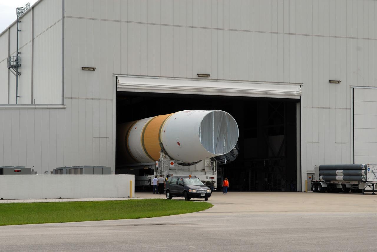 CAPE CANAVERAL, Fla. – The United Launch Alliance Delta IV first stage rolls into the Horizontal Integration Facility on Cape Canaveral Air Force Station's Launch Complex 37.  The Delta IV is the launch vehicle for the latest Geostationary Operational Environmental Satellite, known as GOES-P, developed by NASA for the National Oceanic and Atmospheric Administration, or NOAA.  Photo credit: NASA/Jim Grossmann