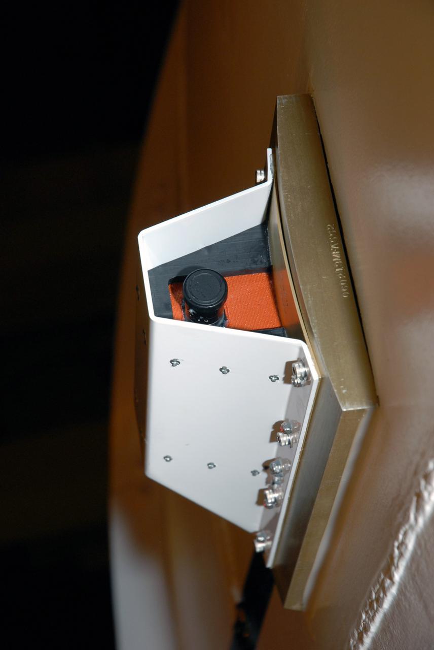 CAPE CANAVERAL, Fla. – A close-up of the video camera installed on the side of the Ares I-X segments 6 and 7, which are in the Vehicle Assembly Building's High Bay 4 at NASA's Kennedy Space Center in Florida. The downward facing camera will provide live video during launch. Part of the Constellation Program, the Ares I-X is the test vehicle for the Ares I, which is the essential core of a space transportation system that eventually will carry crewed missions back to the moon, on to Mars and out into the solar system . The Ares I-X flight test is targeted for no earlier than Aug. 30.  Photo credit: NASA/Jack Pfaller