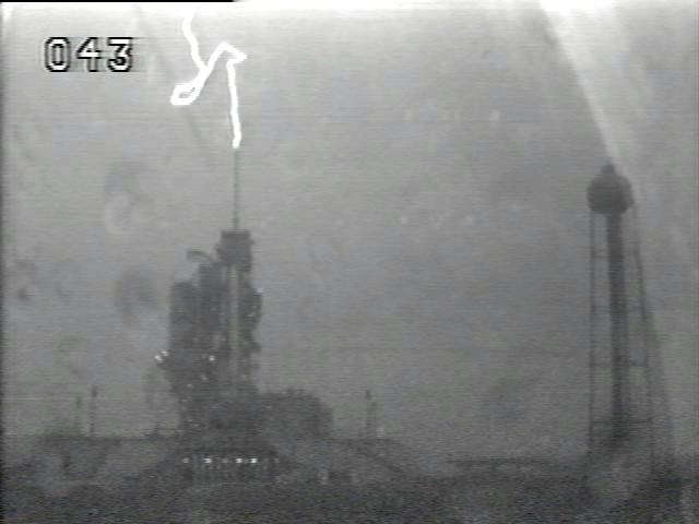 CAPE CANAVERAL, Fla. – A lightning strike on Launch Pad 39A at NASA's Kennedy Space Center in Florida is captured by an Operational Television camera.  Eleven lightning strikes occurred within .35 miles of the pad during a thunderstorm July 10 as space shuttle Endeavour was prepared for launch. Mission managers decided to delay Endeavour's planned liftoff July 11 as a precaution to allow engineers and safety personnel time to analyze data and retest systems on the orbiter and solid rockets boosters.  The next launch attempt for the STS-127 mission is planned for Sunday, July 12, at 7:13 p.m. EDT.  The Operational Television cameras can be used to triangulate the location of lightning strikes. Other detection systems include the Cloud-To-Ground Lightning Surveillance System, Strikenet/National Lightning Detection Network, Lightning Induced Voltage Instrumentation System and the Catenary Wire Lightning Instrumentation System.  Endeavour will deliver the Japanese Experiment Module's Exposed Facility, or JEM-EF, and the Experiment Logistics Module-Exposed Section, or ELM-ES, in the final of three flights dedicated to the assembly of the Japan Aerospace Exploration Agency's Kibo laboratory complex on the International Space Station.  STS-127 is the 29th flight for the assembly of the space station. Photo credit: NASA/Analex