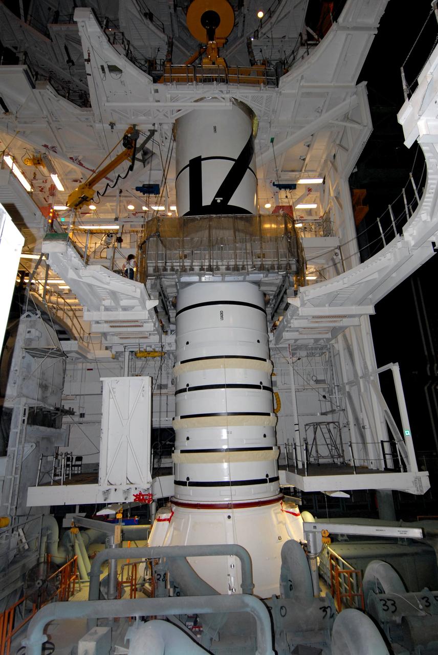 CAPE CANAVERAL, Fla. – In the Vehicle Assembly Building's High Bay 3 at NASA's Kennedy Space Center in Florida, the Ares I-X aft center booster segment is mated to the aft booster and skirt. Part of the Constellation Program, the Ares I-X is the test vehicle for the Ares I, which is the essential core of a space transportation system that eventually will carry crewed missions back to the moon, on to Mars and out into the solar system . The flight test of the Ares I-X is targeted for no earlier than Aug. 30. Photo credit: NASA/Tim Jacobs